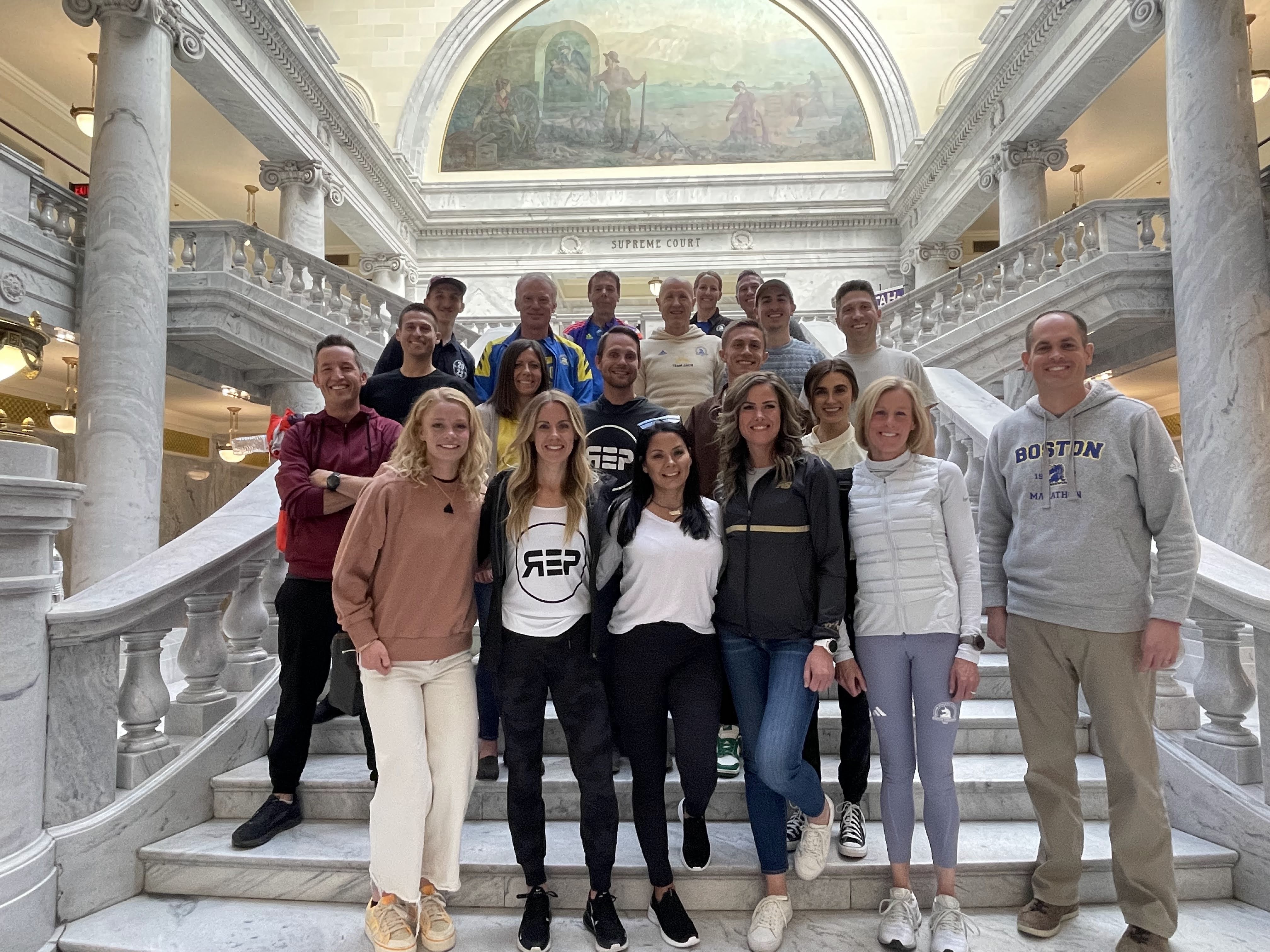 Run Elite Program runners and their families gather at the Utah State Capitol with state senator Mike McKell during a sendoff event ahead of the 127th Boston Marathon.
