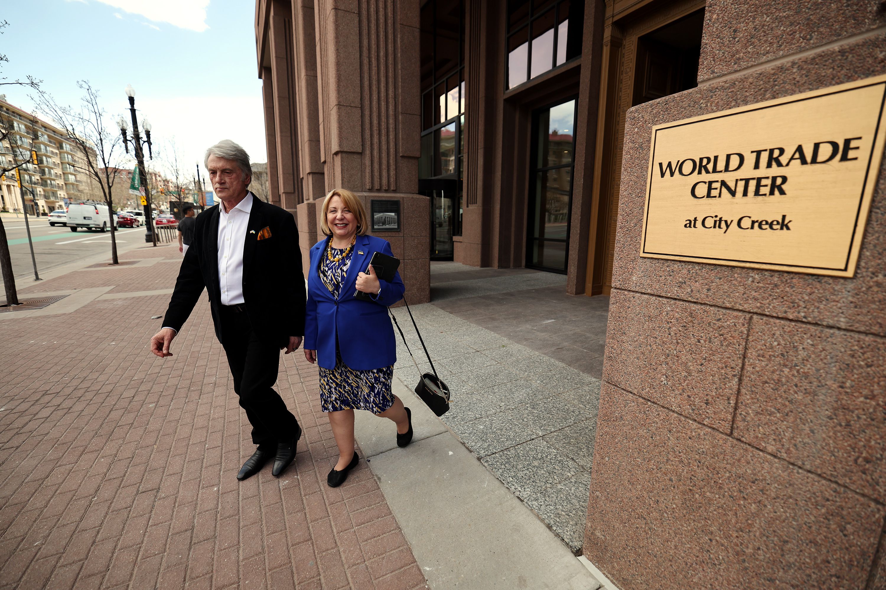 Former Ukrainian President Viktor Yushchenko and his wife Kateryna Yushchenko walk out of the World Trade Center Utah offices in Salt Lake City on Monday.