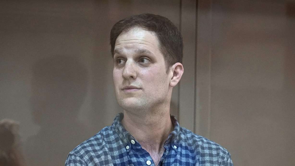 Wall Street Journal reporter Evan Gershkovich stands in a glass cage in a courtroom at the Moscow City Court, in Moscow, Russia, on Tuesday. A Russian judge ruled Tuesday that Gershkovich, who was arrested on spying charges, will remain jailed.