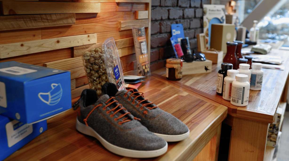 Products line a wall in Jeremy Brockbank’s office of products he has introduced to retailers.