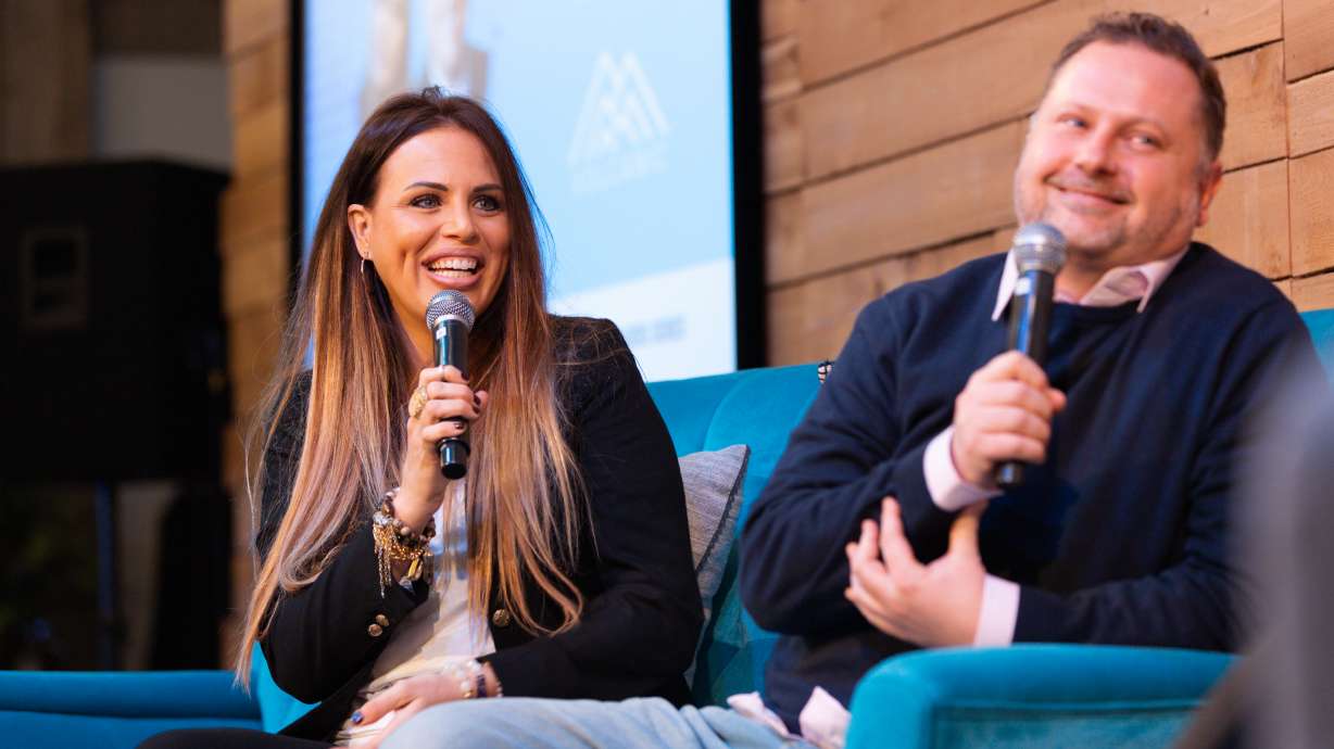 Volcanic CEO Jeremy Brockbank and Jen Brockbank speak to an audience at RevRoad in Provo.