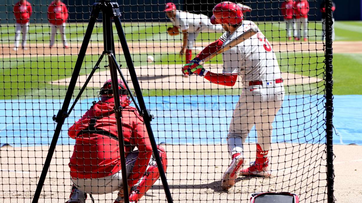 Philadelphia Phillies' Bryce Harper swings as he faces a left handed pitcher during batting practice before game one of a baseball double header against the Chicago White Sox, Tuesday, April 18, 2023, in Chicago.