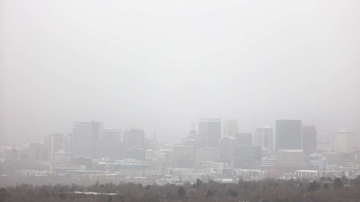 Visibility is limited as dust blows over Salt Lake City during a windstorm on Tuesday. Fine particulate readings in Tooele were well above the federal threshold imposed by the U.S. Environmental Protection Agency.