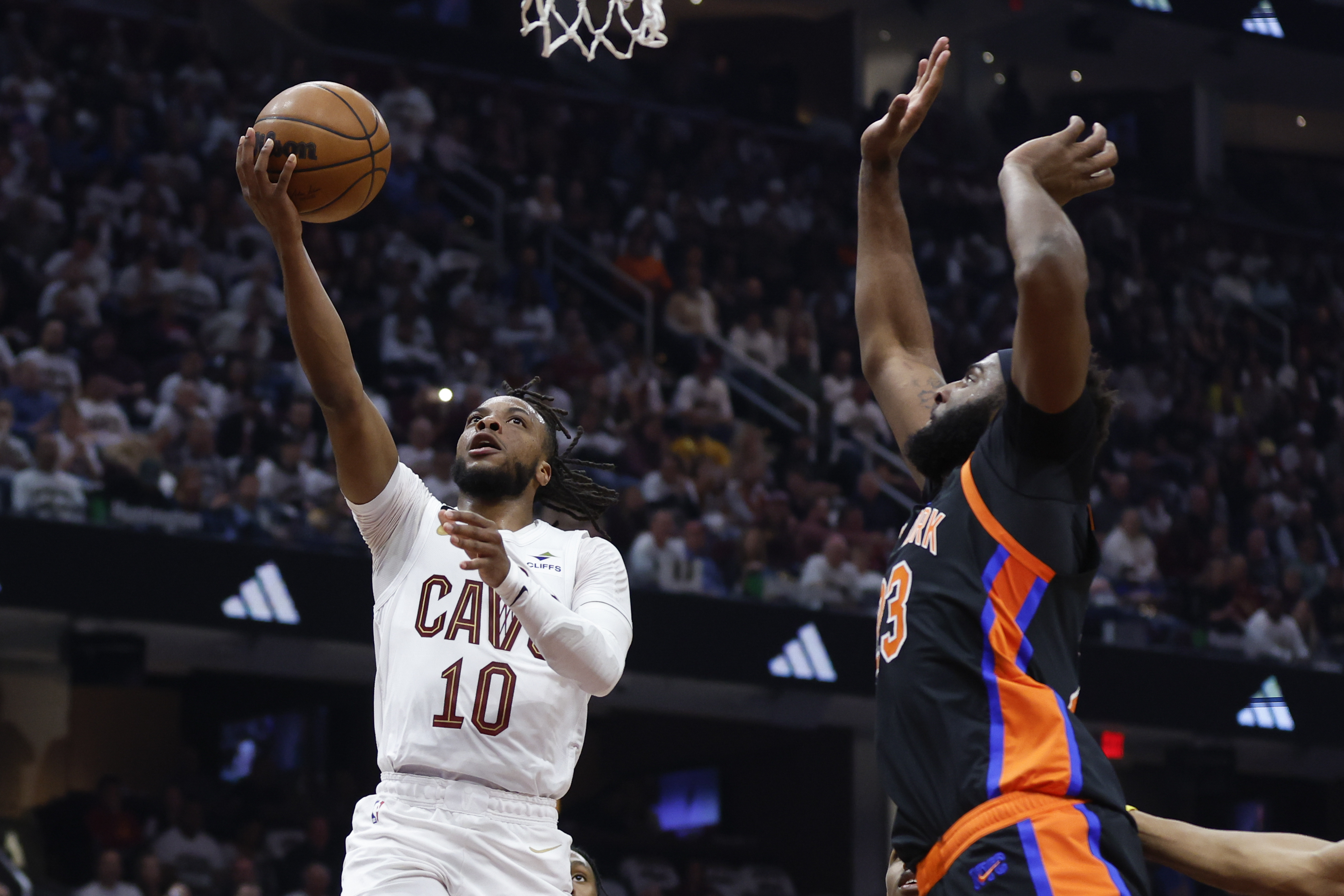 Cleveland Cavaliers guard Darius Garland (10) shoots against New York Knicks center Mitchell Robinson during the first half of Game 2 of an NBA basketball first-round playoff series Tuesday, April 18, 2023, in Cleveland. 