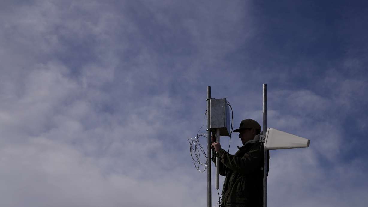 Carver Cammans installs cloud seeding equipment Dec. 3, 2022, in Lyons, Colo. The technique to get clouds to produce more snow is being used more as the Rocky Mountain region struggles with a two-decade drought.