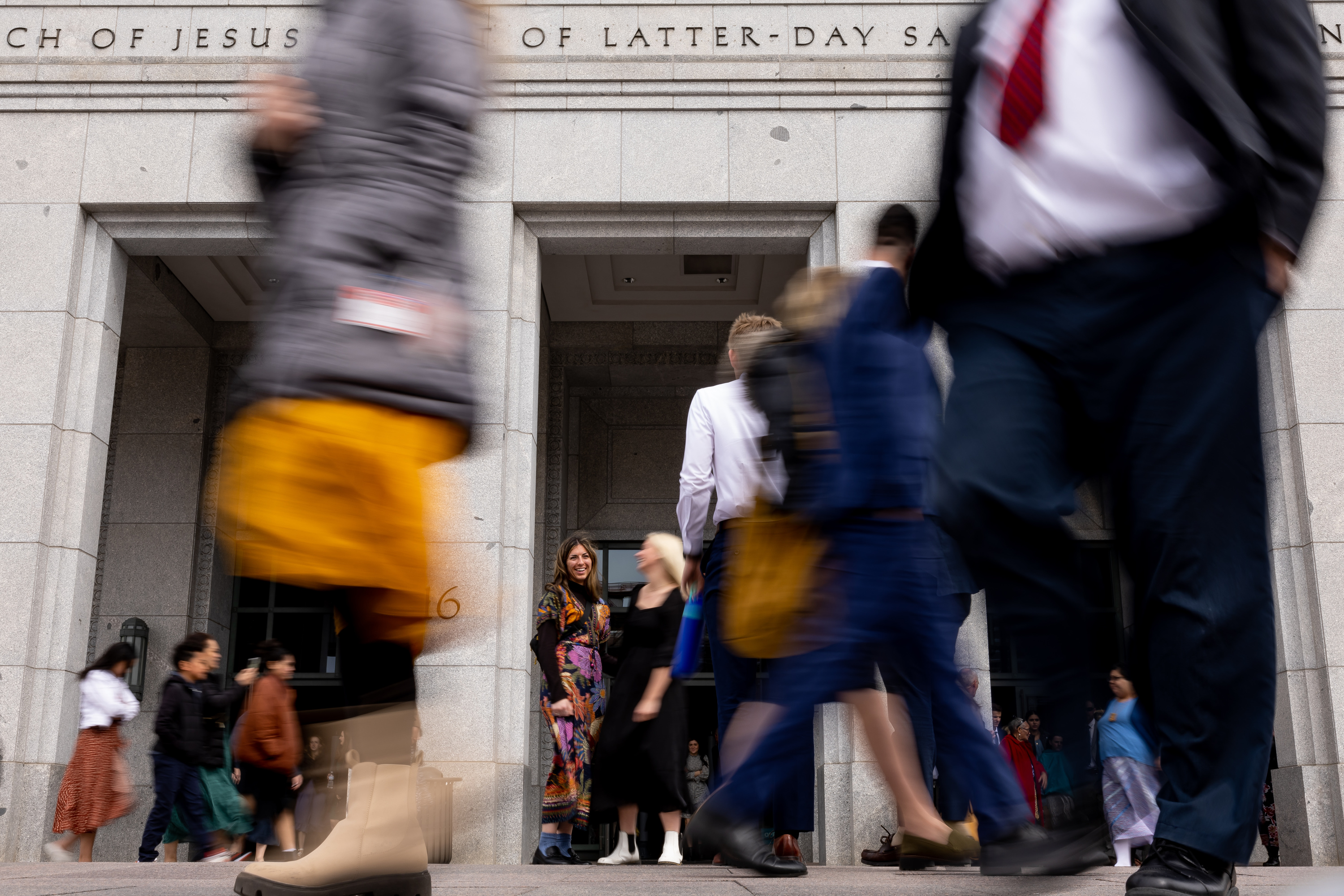 People walk outside of the Conference Center in Salt Lake City after the Saturday morning session of the 193rd Annual General Conference of The Church of Jesus Christ of Latter-day Saints on Saturday, April 1, 2023.