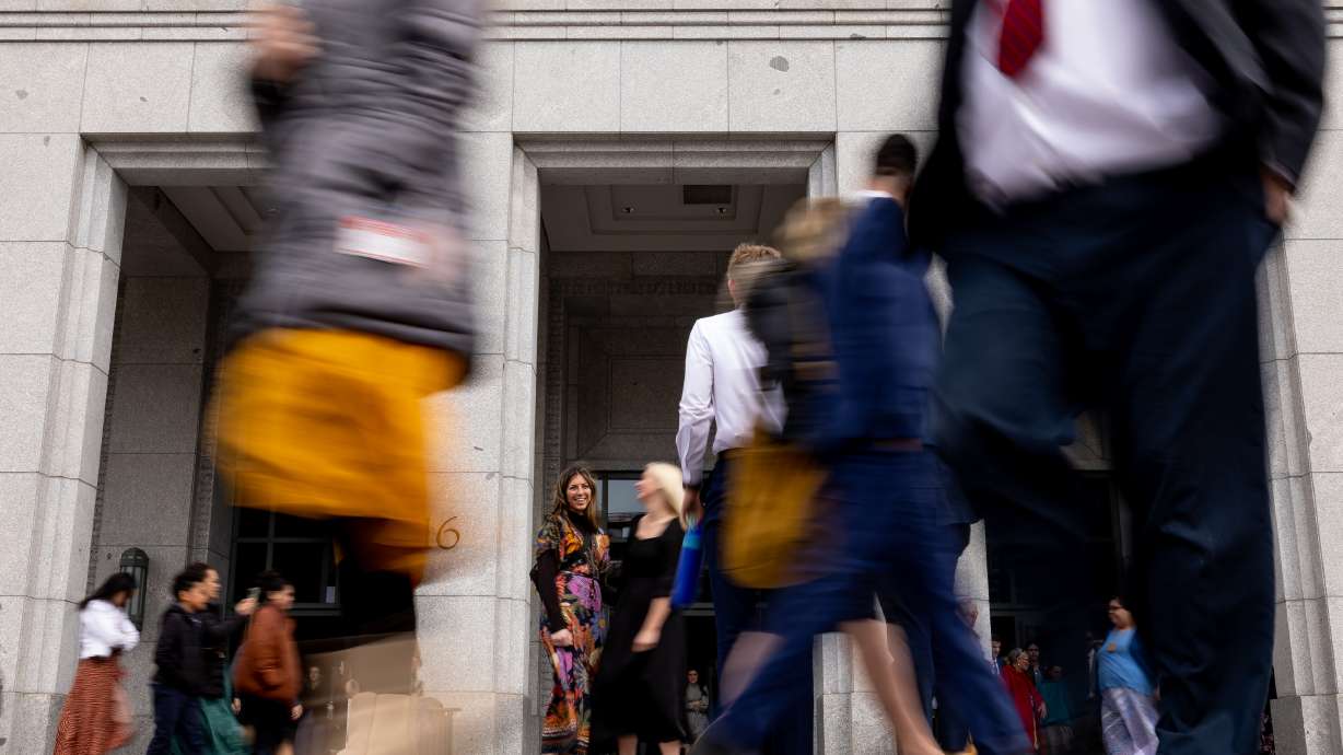 People walk outside of the Conference Center in Salt Lake City after the Saturday morning session of the 193rd Annual General Conference of The Church of Jesus Christ of Latter-day Saints on Saturday, April 1, 2023.