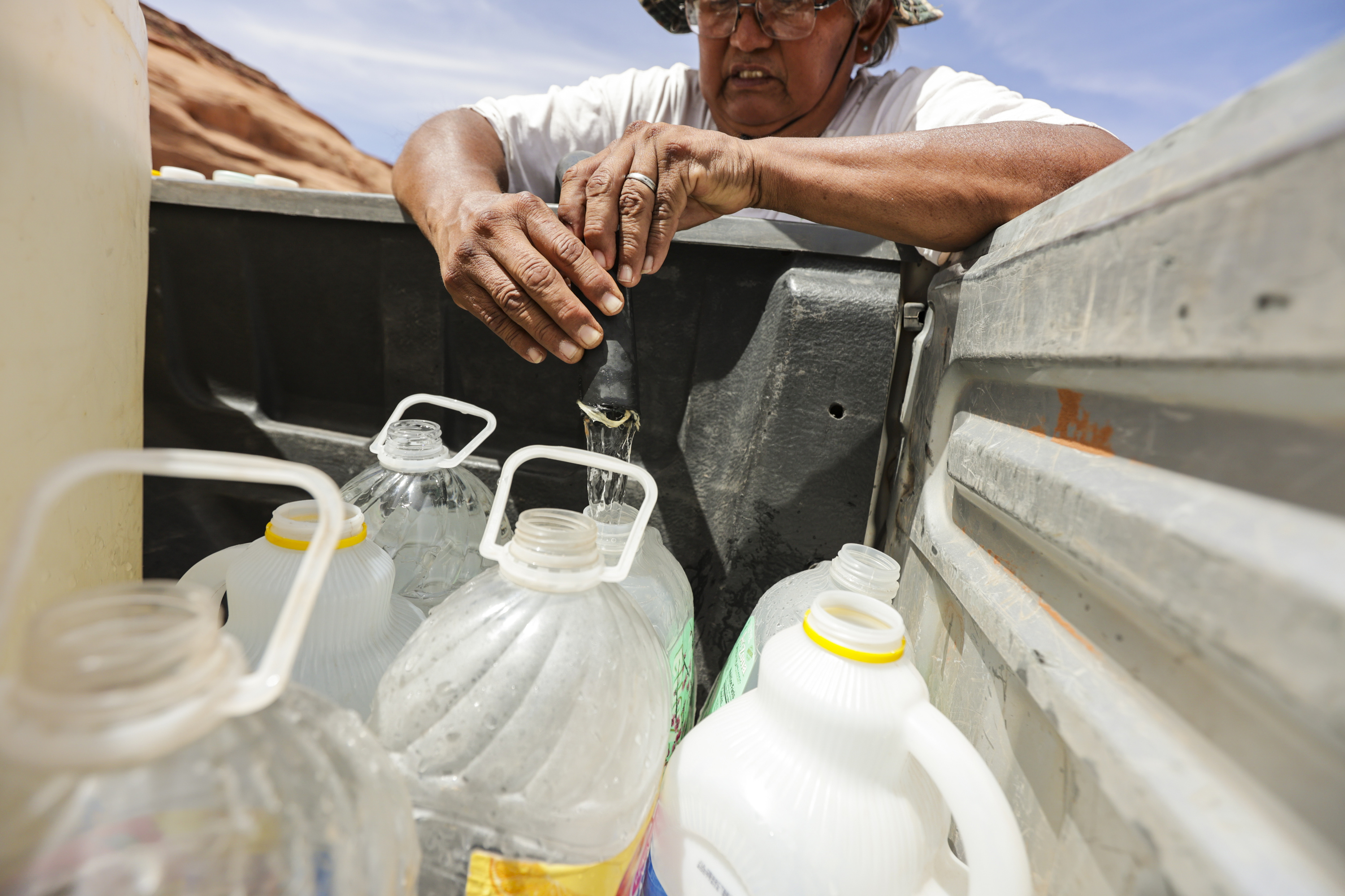 Ron Atine fills up water bottles at a well in Goulding, San Juan County, on May 27, 2022. Utah experts weighed in Wednesday on how Indigenous communities are pushing back against water rights issues and what the community can do to support them.