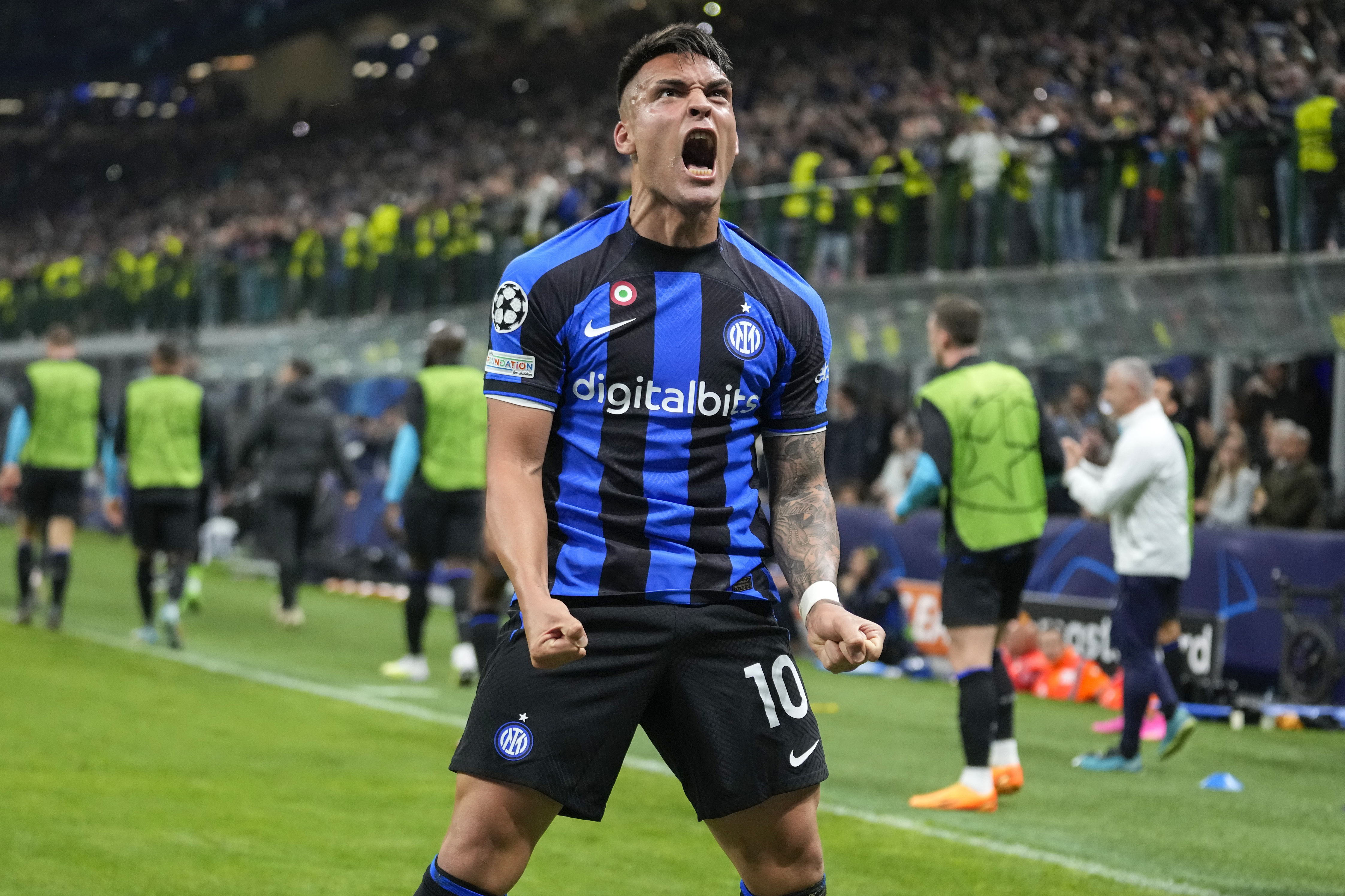 Inter Milan's Lautaro Martinez celebrates after scoring his side's second goal during the Champions League quarterfinal second leg soccer match between Inter Milan and Benfica at the San Siro stadium in Milan, Italy, Wednesday, April 19, 2023. 