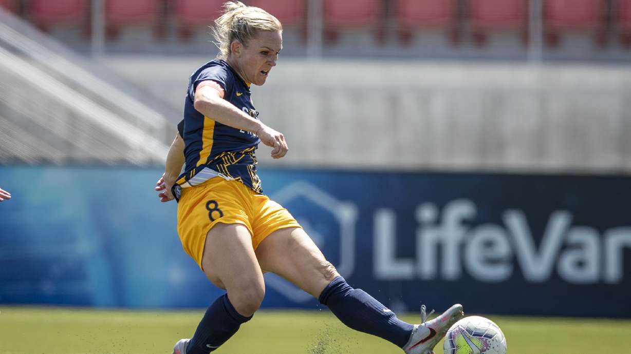 Utah Royals FC forward Amy Rodriguez (8) shoots and scores a goal ahead of Sky Blue FC defender Kaleigh Riehl (2) as the Utah Royals and Sky Blue play in the National Women's Soccer League Challenge Cup at Zions Bank stadium in Herriman on Saturday, July 4, 2020. Utah won 1-0.