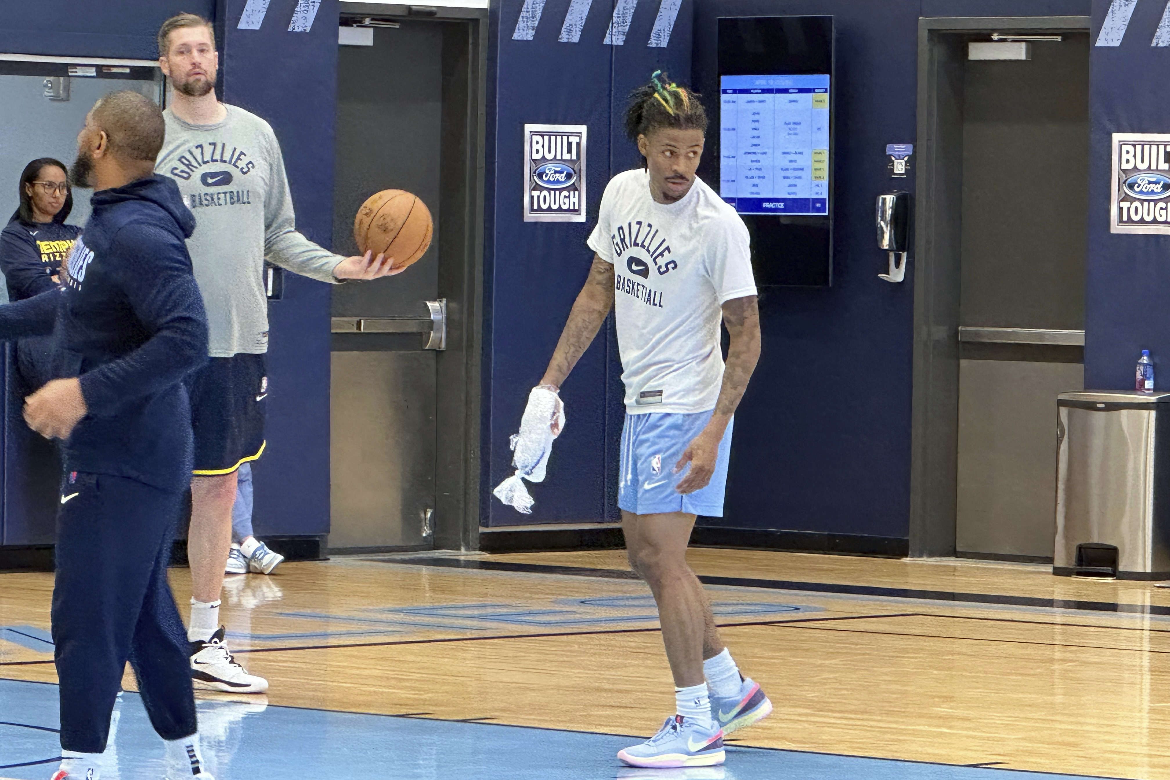 Memphis Grizzlies guard Ja Morant ices his right hand at the end of NBA basketball practice Tuesday, April 18, 2023. Morant had an MRI that showed no ligament damage after he landed awkwardly on his right hand in a loss to the Los Angeles Lakers in Game 1 in the first round of the playoffs Sunday. Coach Taylor Jenkins said Morant is a game-time decision dealing with soft tissue bruising between the bones. 