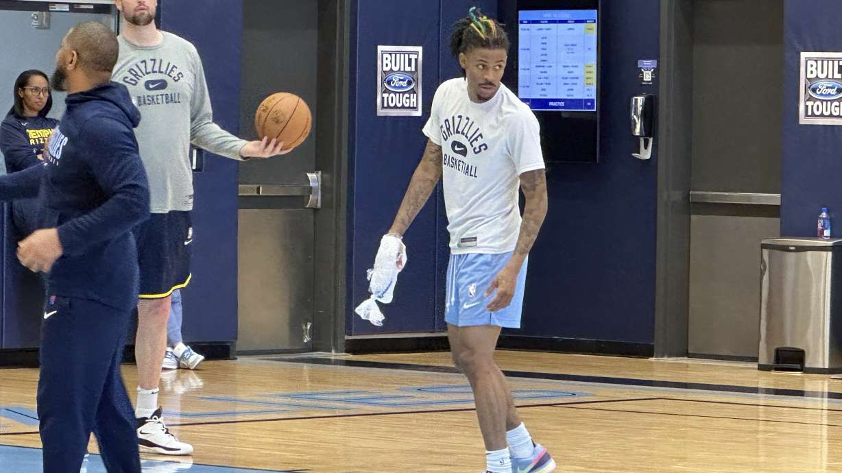 Memphis Grizzlies guard Ja Morant ices his right hand at the end of NBA basketball practice Tuesday, April 18, 2023. Morant had an MRI that showed no ligament damage after he landed awkwardly on his right hand in a loss to the Los Angeles Lakers in Game 1 in the first round of the playoffs Sunday. Coach Taylor Jenkins said Morant is a game-time decision dealing with soft tissue bruising between the bones.