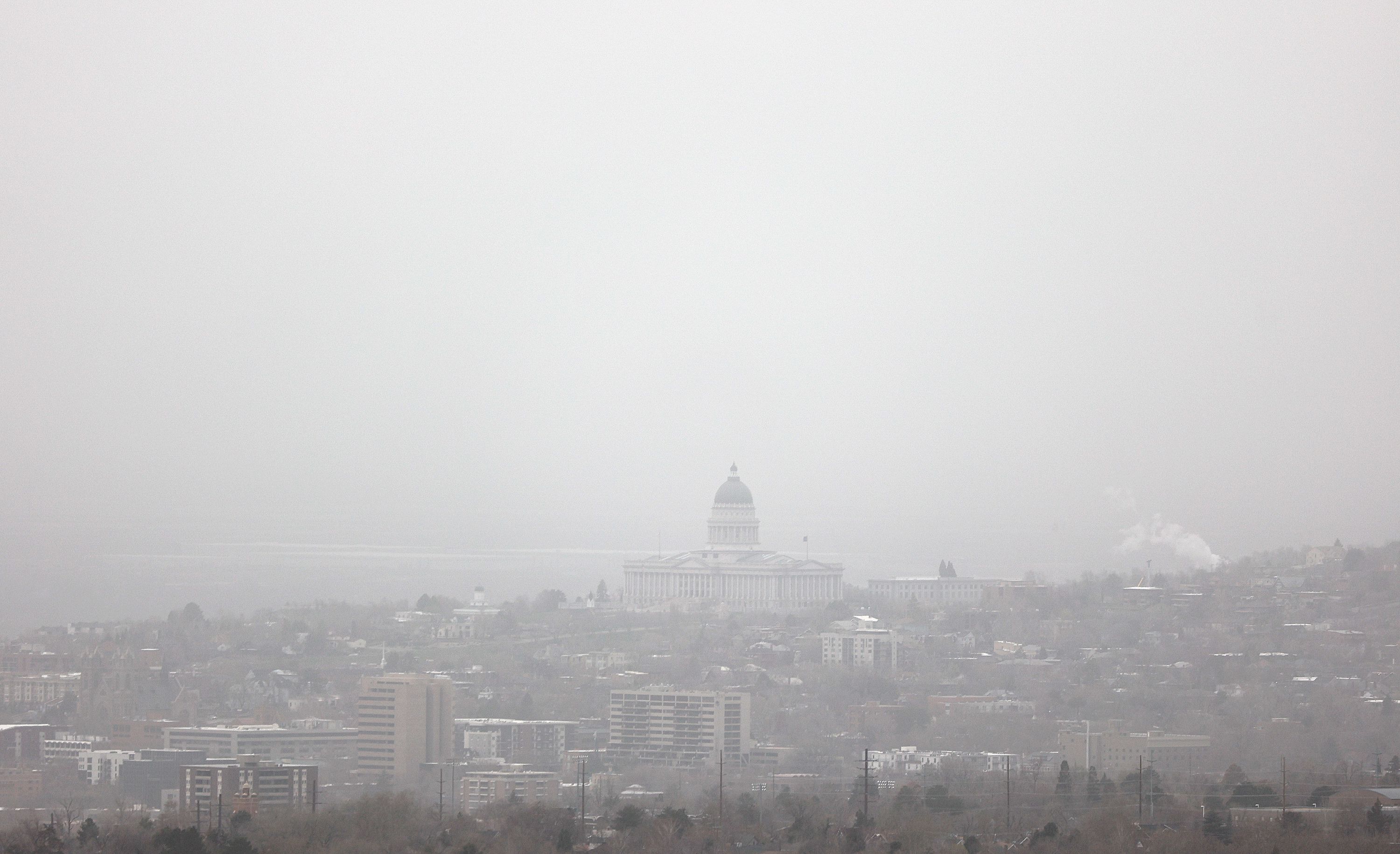 Visibility is limited as dust blows over Salt Lake City during a windstorm on Tuesday. Northern Utah suffers from poor air quality, according to reports.