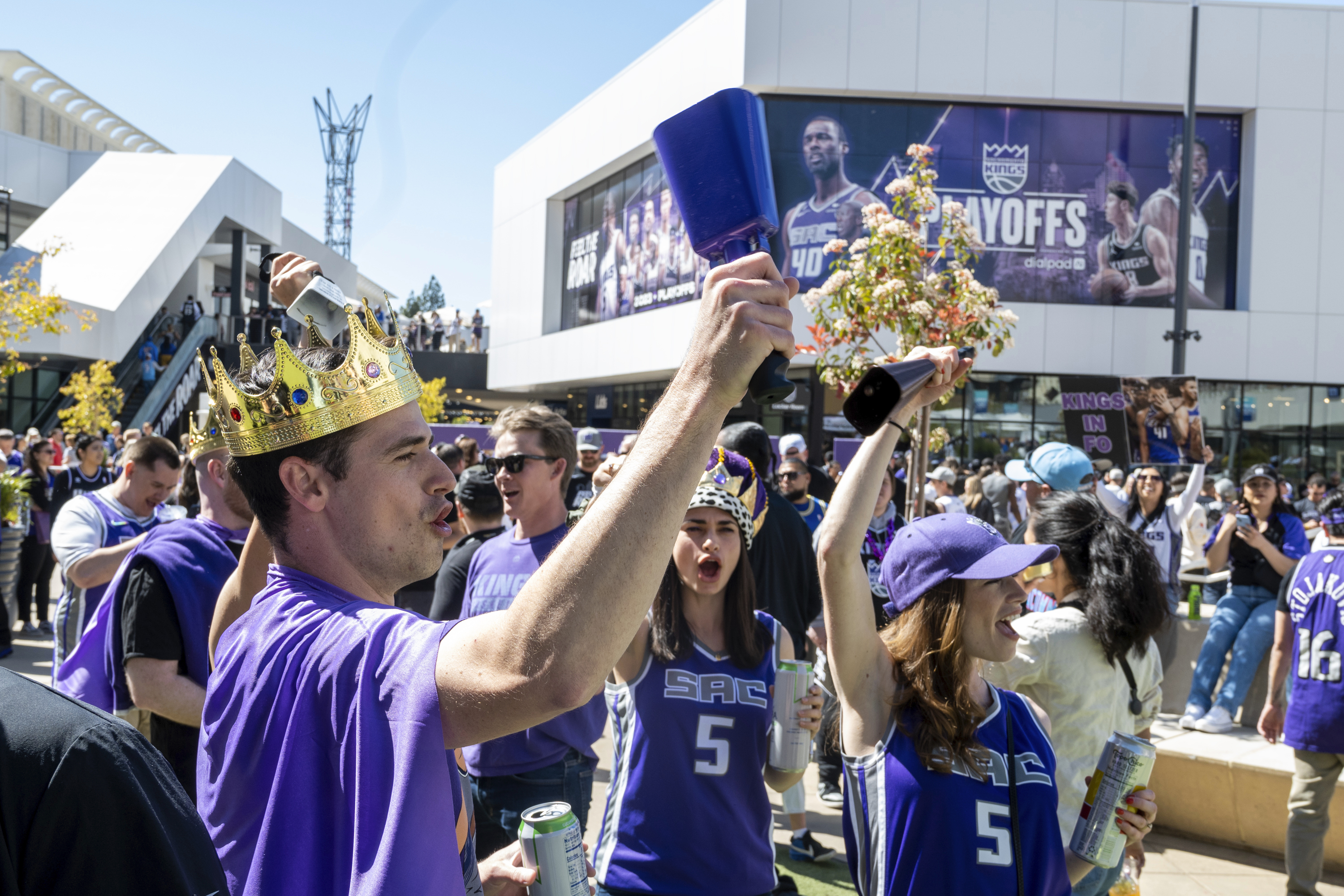 Sacramento Kings fans celebrate the team's first appearance in the playoffs since 2006 outside of Golden 1 Center before Game 1 against the Golden State Warriors in the first round of the NBA basketball playoffs in Sacramento, Calif., Saturday, April 15, 2023. 