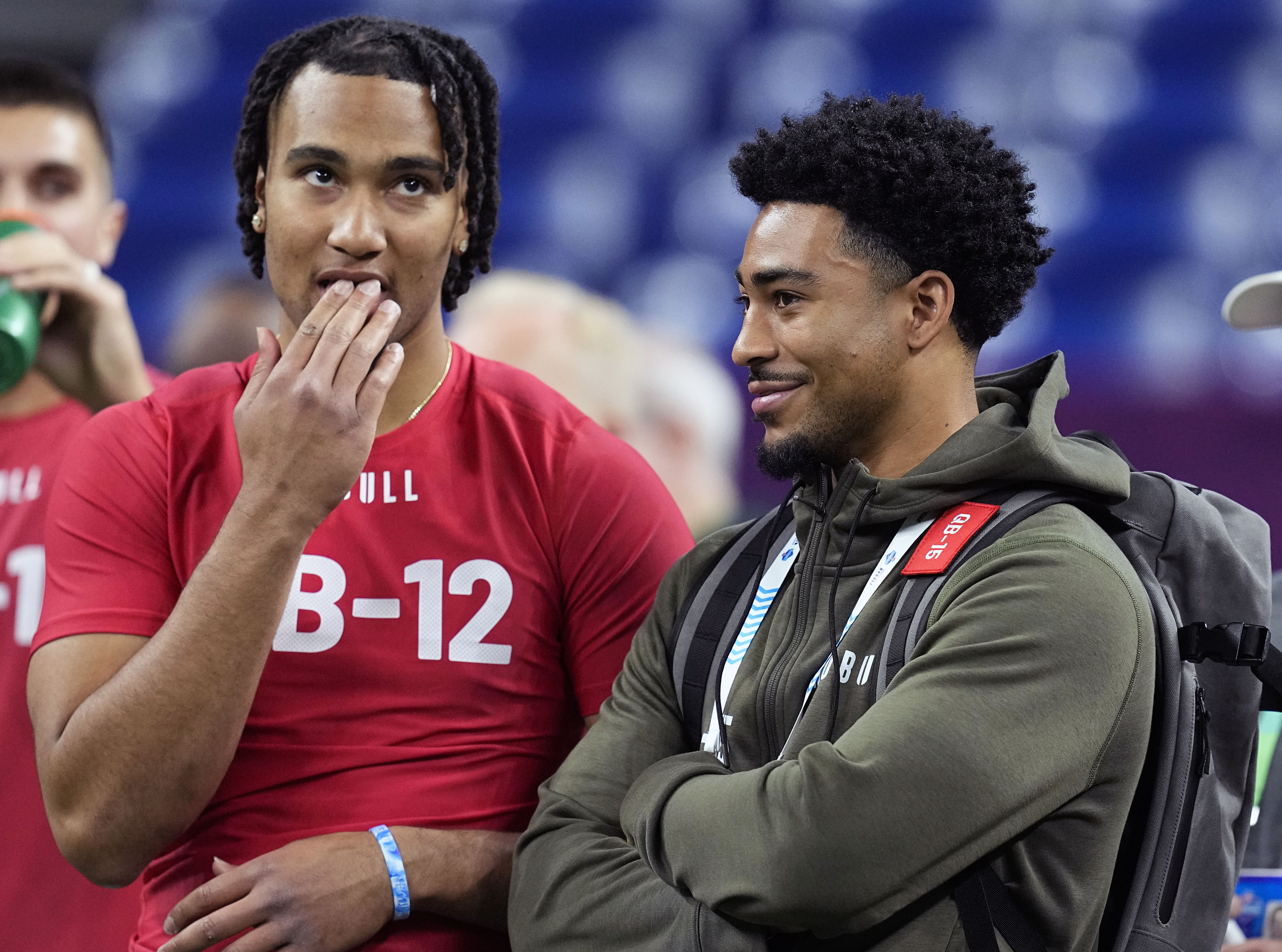 FILE - Ohio State quarterback CJ Stroud, left, talks to Alabama quarterback Bryce Young at the NFL football scouting combine in Indianapolis, Saturday, March 4, 2023. The Carolina Panthers have been on the clock since making a blockbuster trade last month to acquire the No. 1 overall pick in the NFL draft and get their choice of potential franchise quarterbacks. There is still no general consensus on which QB will go first. Stroud or Young? 