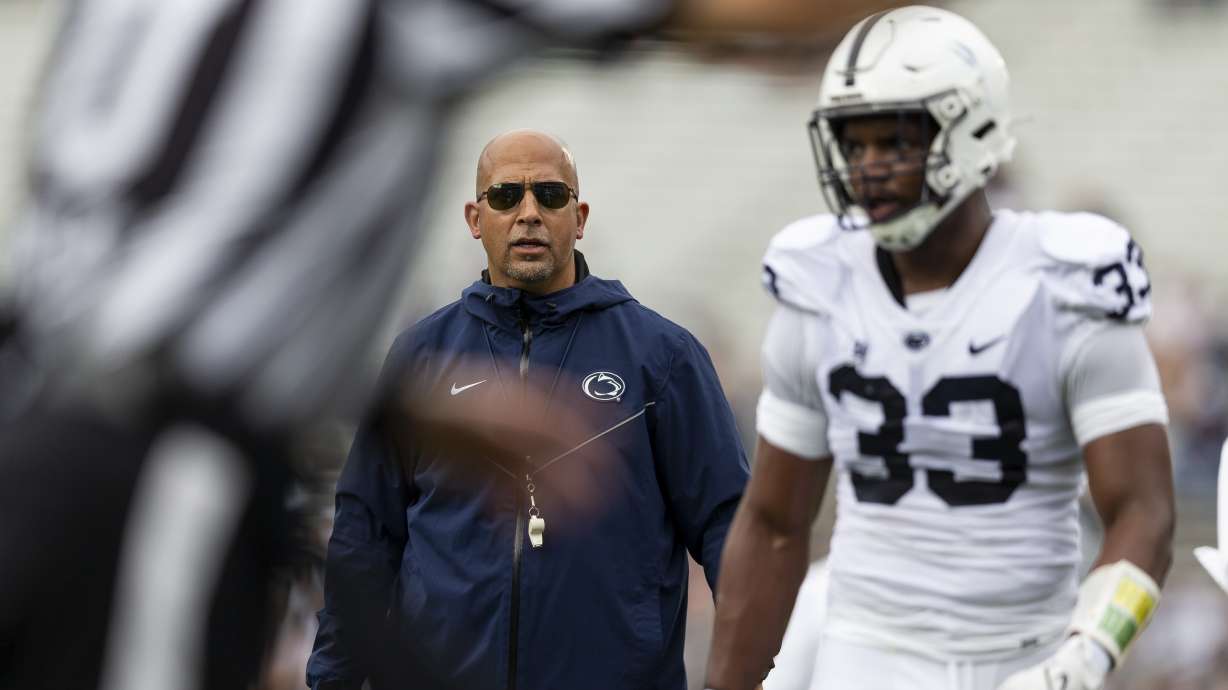 Penn State coach James Franklin talks to defensive end Dani Dennis-Sutton during the second quarter of the NCAA college football team's Blue-White spring game Saturday, April 15, 2023, in State College, Pa.