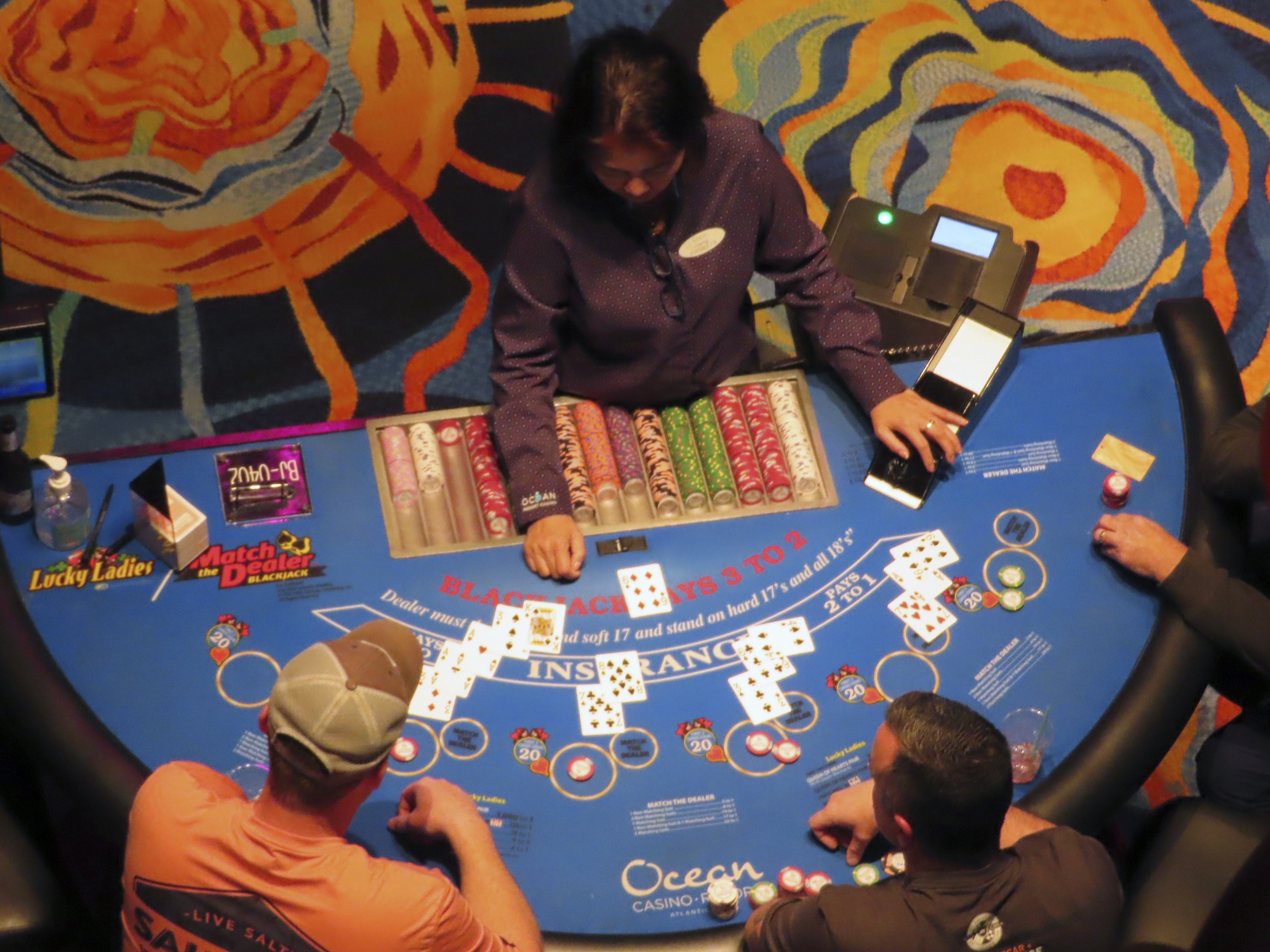 A dealer conducts a card game at the Ocean Casino Resort in Atlantic City, N.J., Dec. 2, 2022. Figures released April 10, 2023, by New Jersey gambling regulators show the city's nine casinos collectively posted a gross operating profit of $731 million in 2022, down 4.6% from the previous year. 