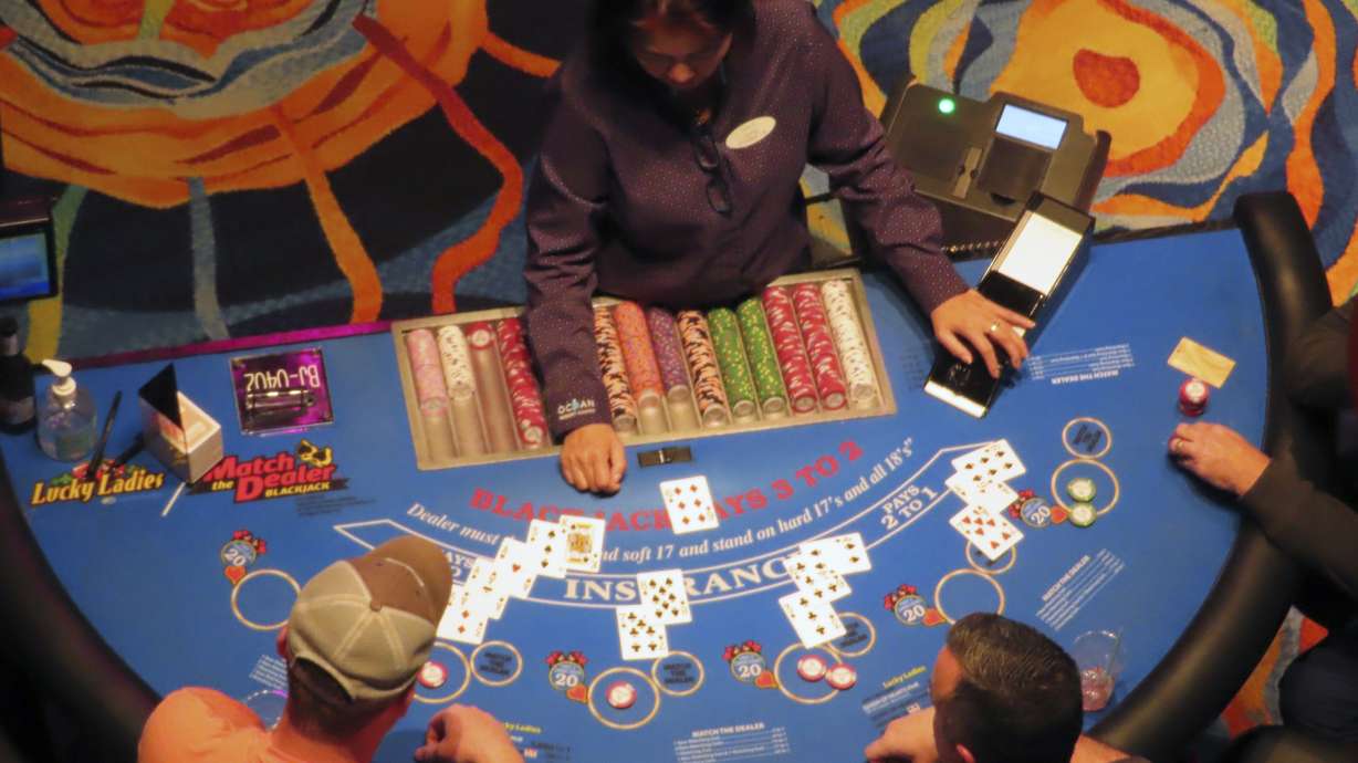 A dealer conducts a card game at the Ocean Casino Resort in Atlantic City, N.J., Dec. 2, 2022. Figures released April 10, 2023, by New Jersey gambling regulators show the city's nine casinos collectively posted a gross operating profit of $731 million in 2022, down 4.6% from the previous year.