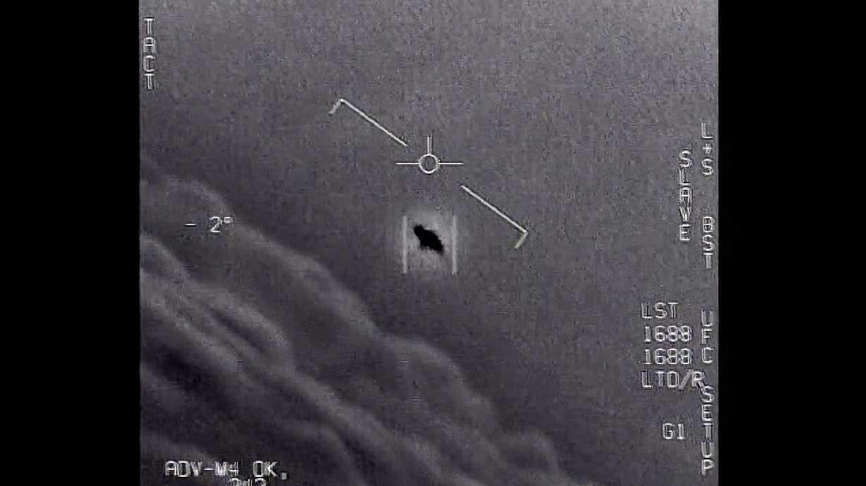 In an image provided by the Department of Defense labeled Gimbal, from 2015, an unexplained object is seen at center as it is tracked high along the clouds. The Pentagon is tracking 650 UFO cases.
