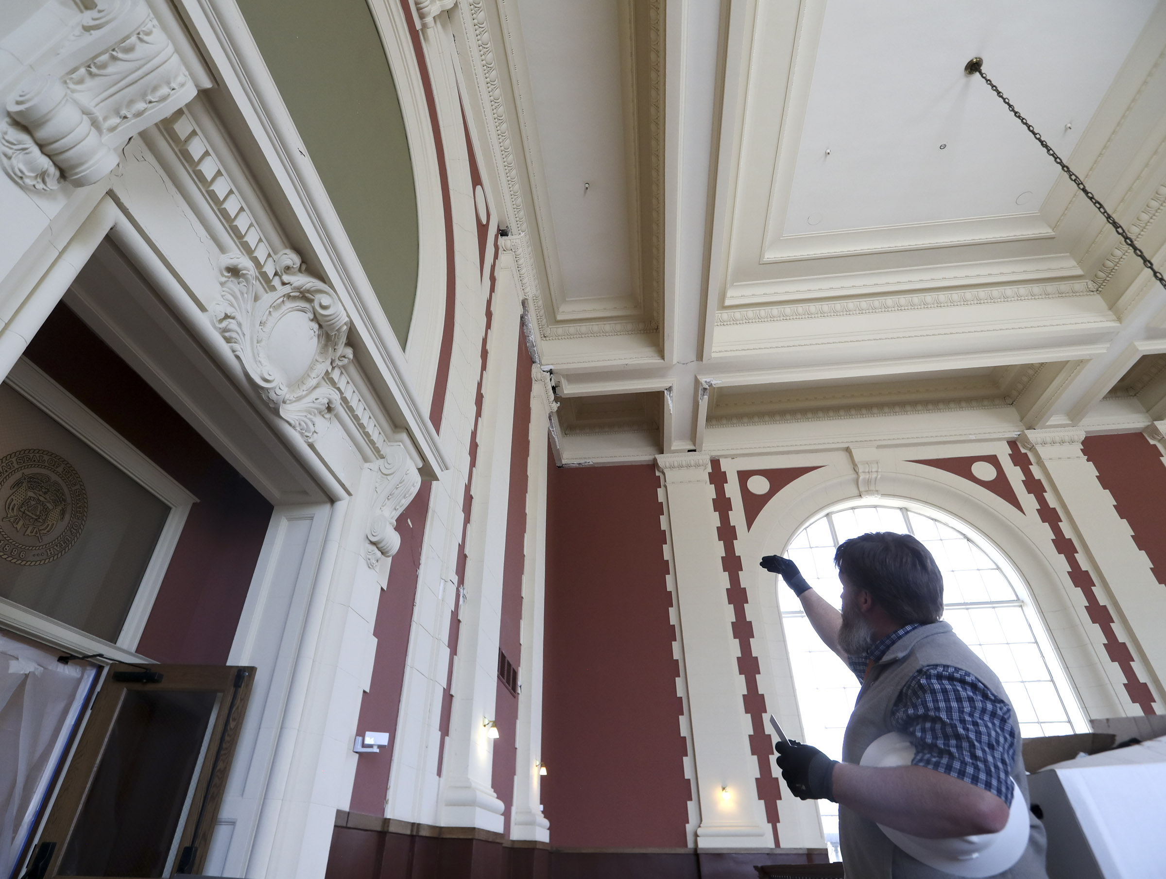Jon Vance, project manager for the state's Division of Facilities Construction and Management, looks at damage to the Rio Grande Depot in Salt Lake City on April 9, 2020.