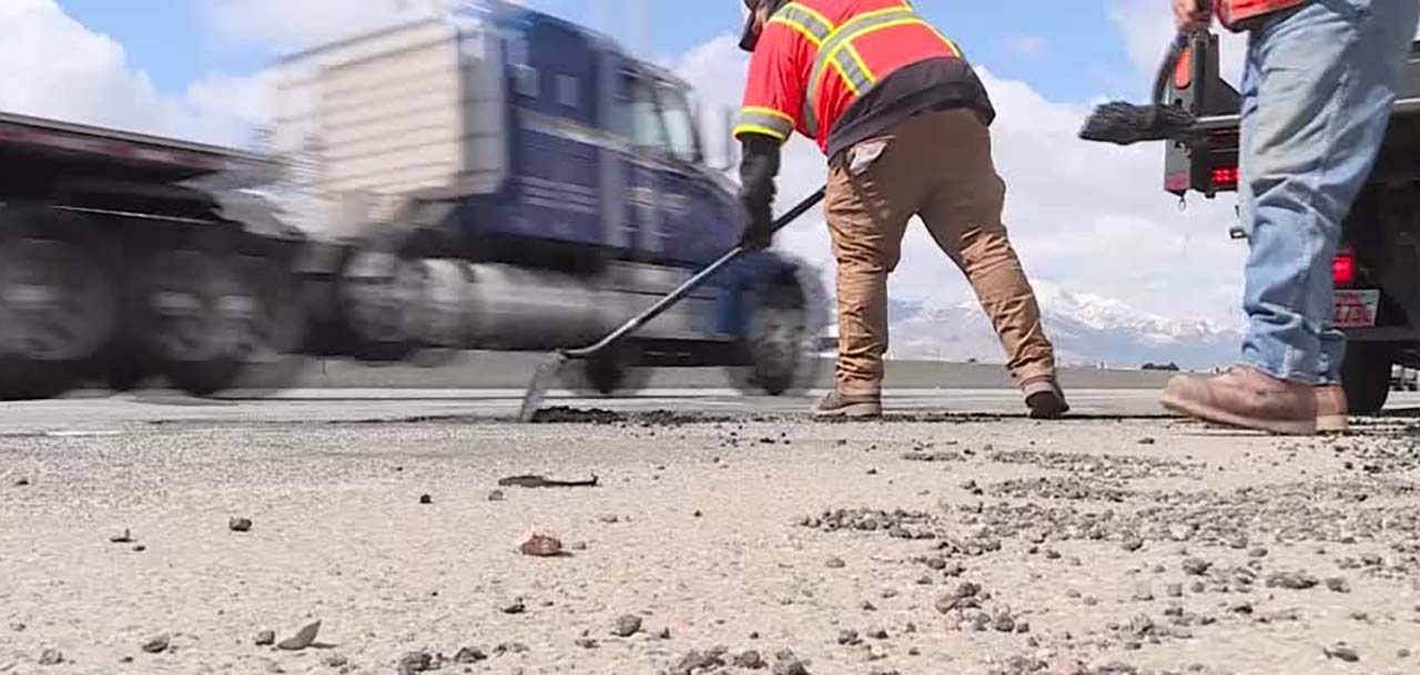 UDOT crews patch potholes on Thursday. They have been doing this all winter, filling many of the same holes week after week.