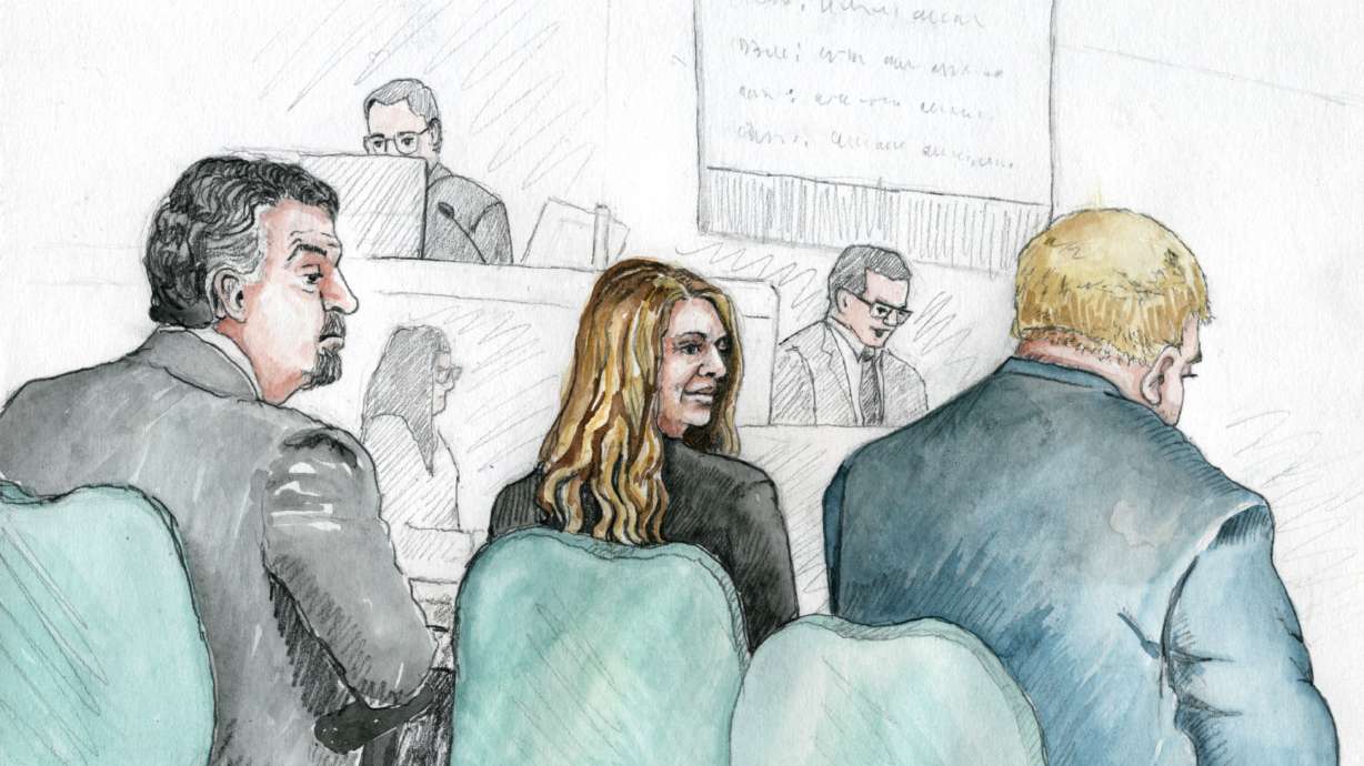 Lori Vallow Daybell sits between her attorneys at her jury trial in Boise on April 14. She is charged with first-degree murder in the deaths of her two children, Tylee and JJ.