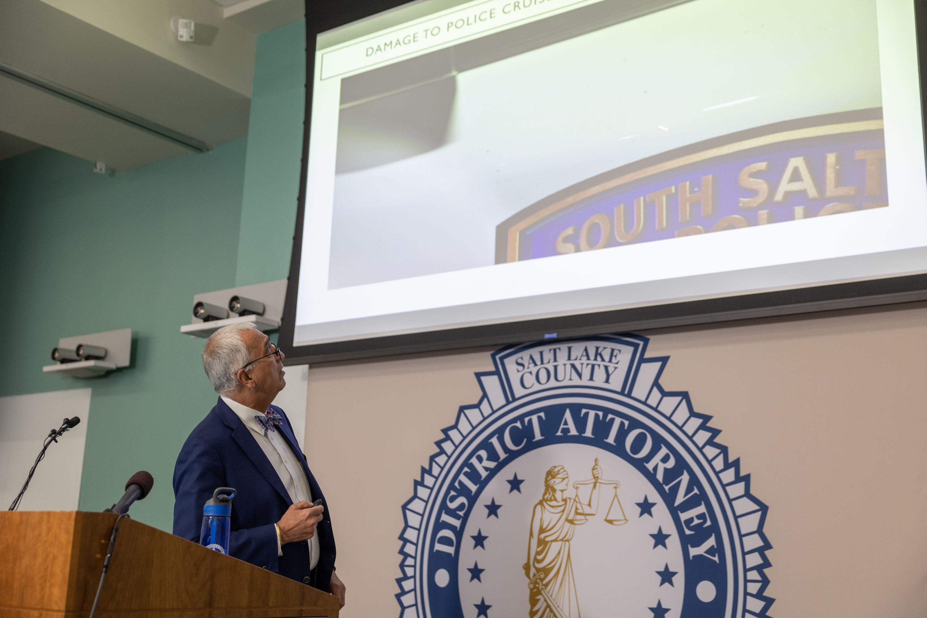 Salt Lake County District Attorney Sim Gill displays evidence Friday during a press conference about a police shooting at the office building of the Salt Lake County District Attorney's Office in Salt Lake City.