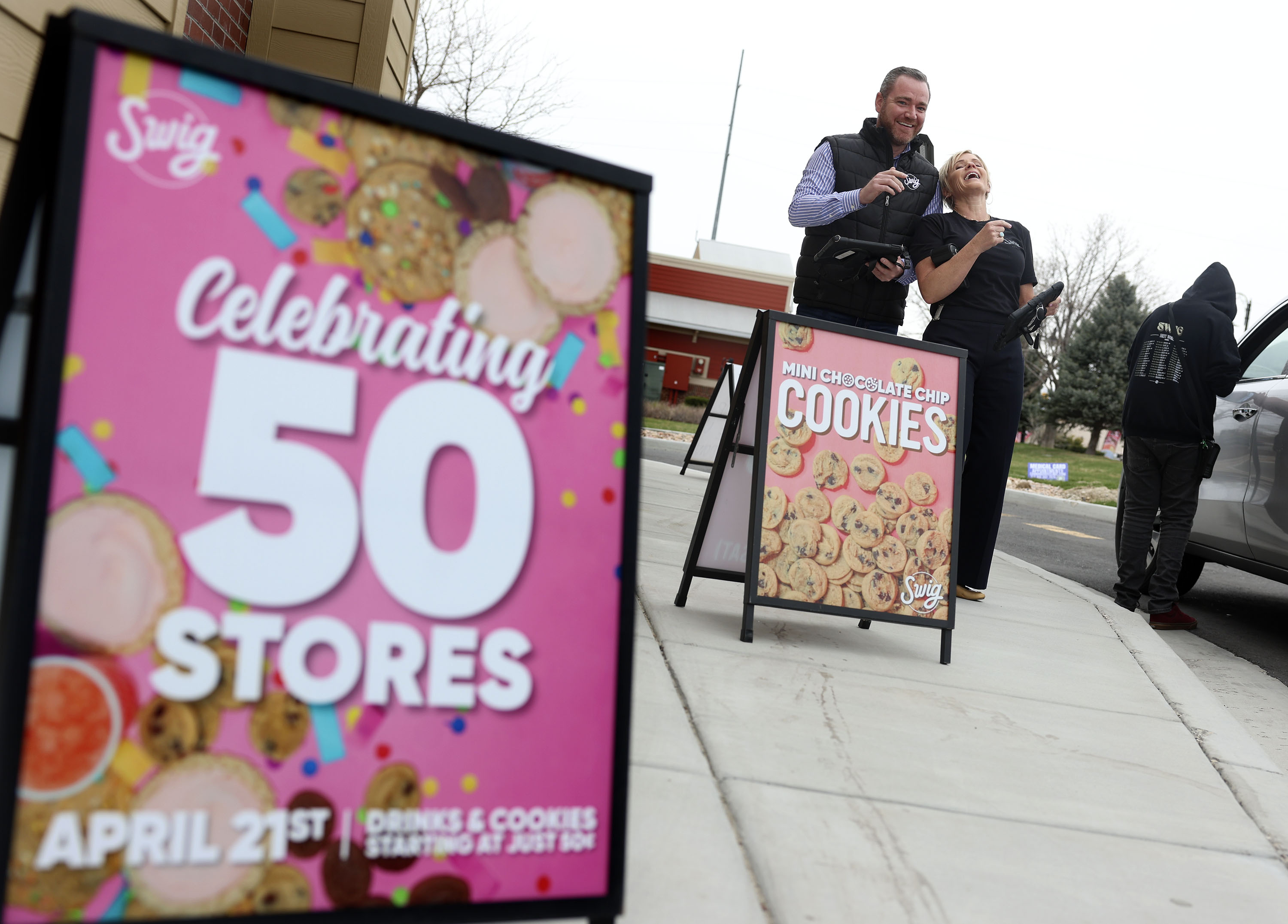 Rian McCartan, CEO of Swig, and Nicole Tanner, founder of Swig, prepare to take orders at the drive-thru at Swig in Sandy on Friday.