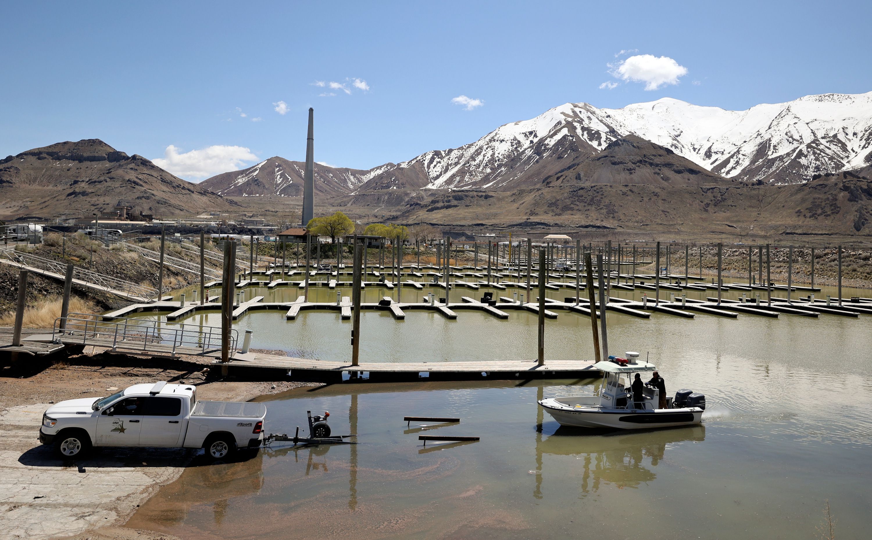 Division of Parks ranger Trent Currie and Steve Bullock, Division of Recreation law enforcement chief with the Utah Department of Natural Resources, load a boat onto a trailer during boat operating training in the Great Salt Lake State Park marina in Magna on Wednesday.