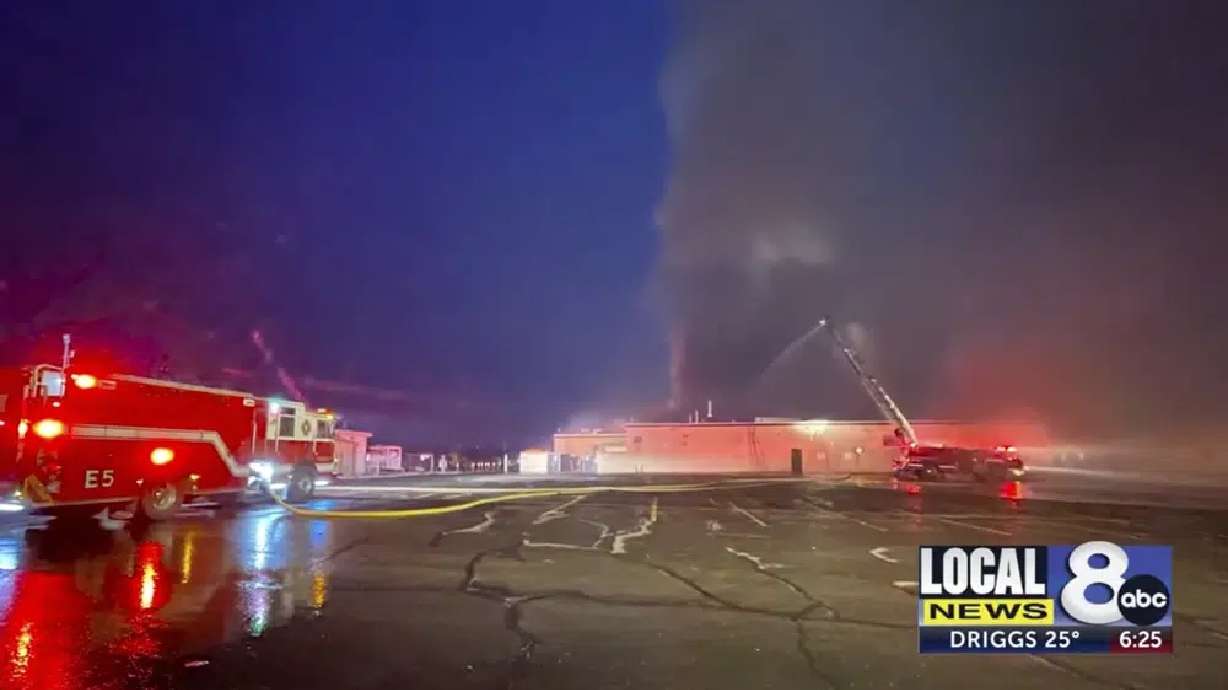 In this image taken from video from KIFI Local News 8, firefighters work on the scene of an early morning fire at a large high school in Pocatello, Idaho, Friday,
