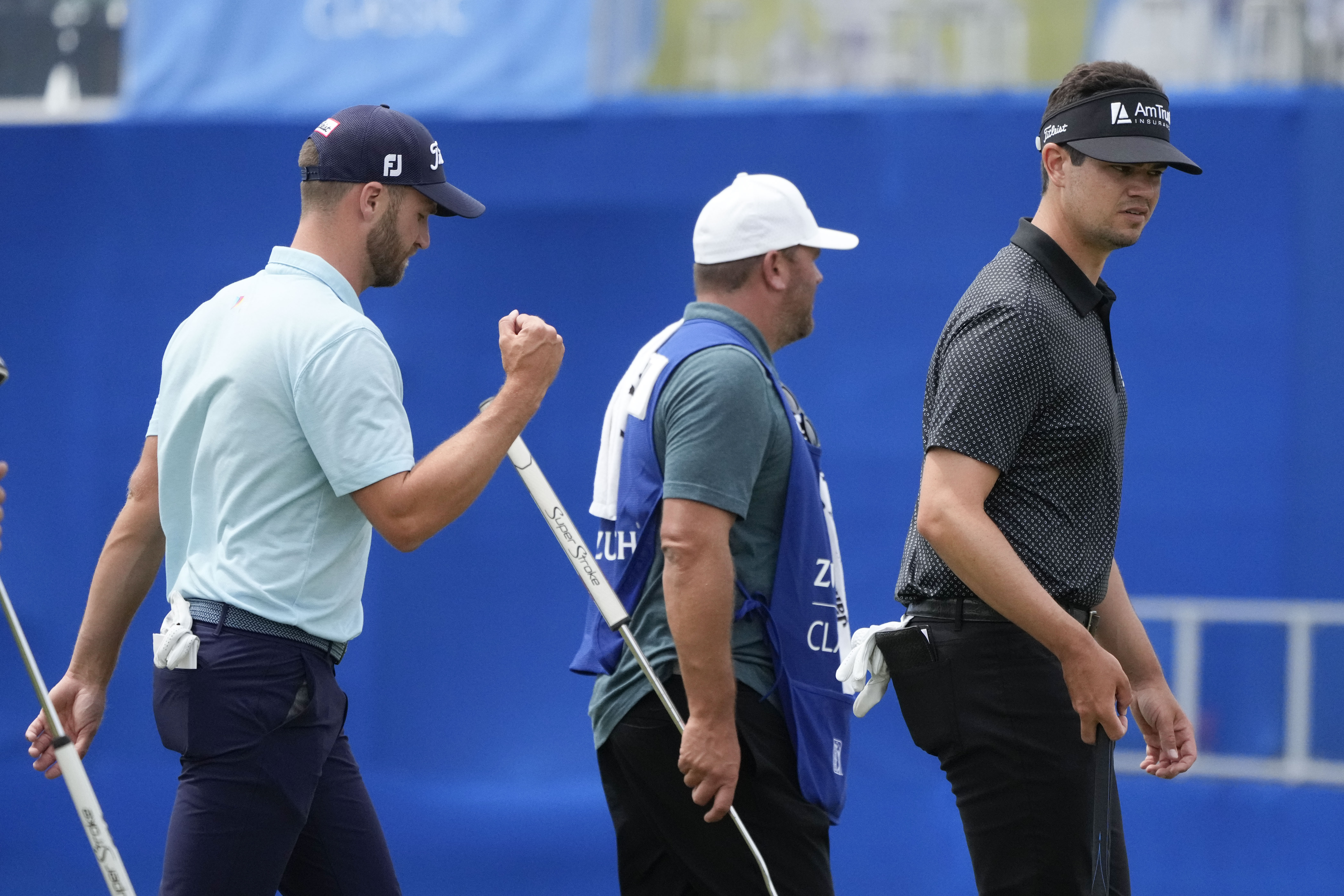 Wyndham Clark, left, and his teammate Beau Hossler, right, walk off the 9th green after finishing for the day during the second round of the PGA Zurich Classic golf tournament at TPC Louisiana in Avondale, La., Friday, April 21, 2023. 