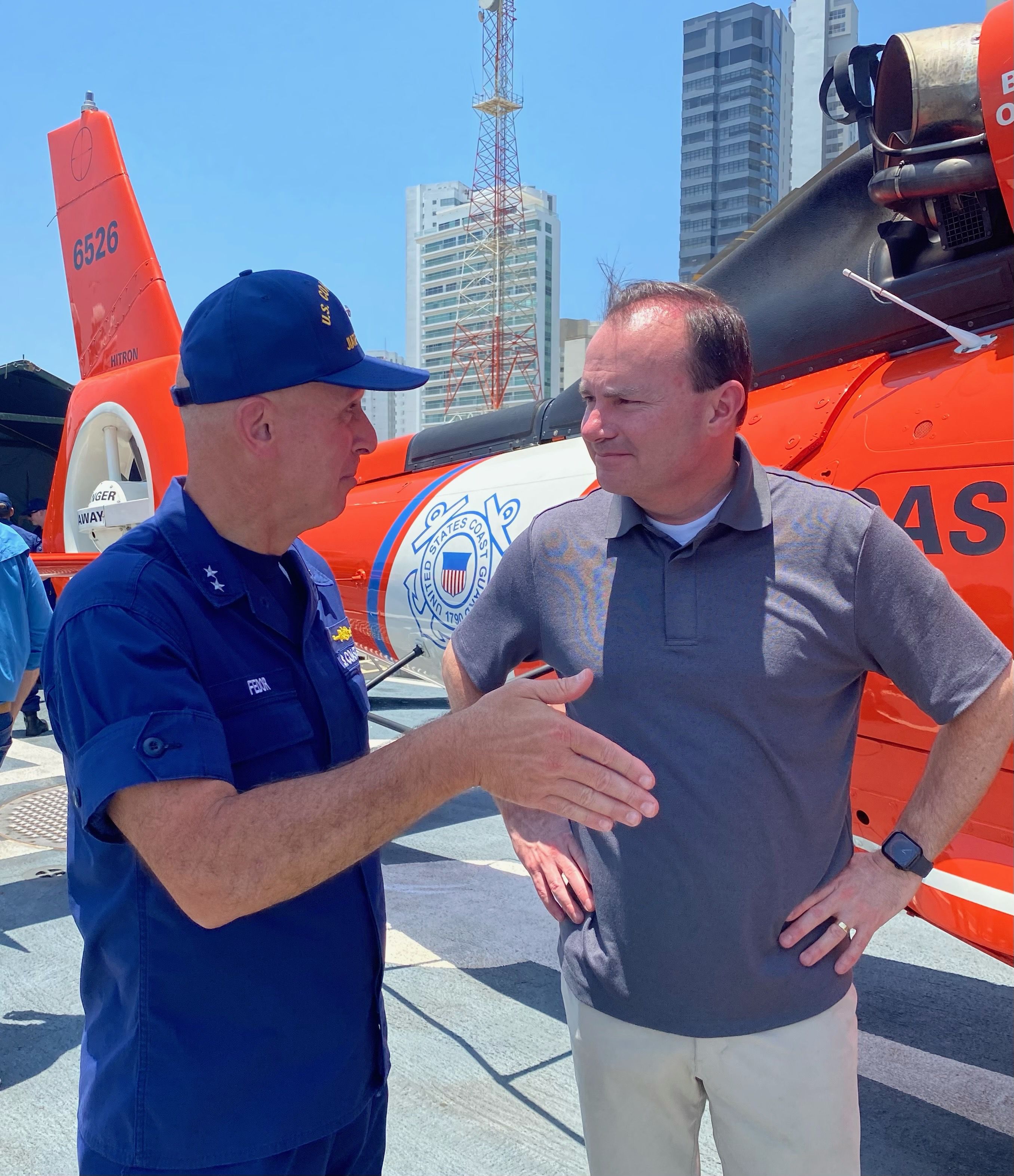 Utah Sen. Mike Lee discusses the challenges of drug smuggling and illegal immigration with Coast Guard Rear Adm. Mark Fedor on board a USCGC Tampa during a recent trip to Central and South America.