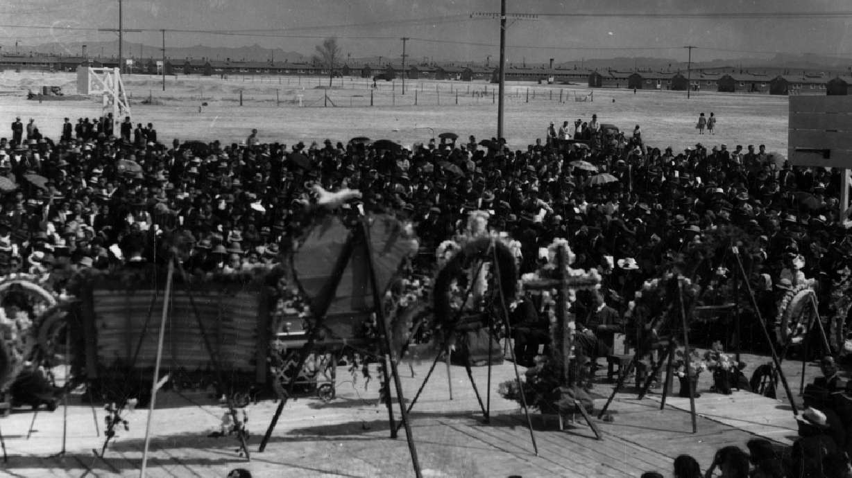 Thousands of inmates gather at the Topaz War Relocation Center on April 19, 1943, for the funeral of James Hatsuaki Wakasa, who was shot and killed by a guard 80 years ago this month.