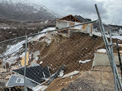 Two previously condemned homes located at 2463 and 2477 E. Springtime Road, in Draper, collapsed and slid down the hill overnight Saturday.
