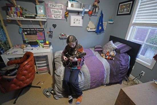 Elle Palmer, 13, plays her mandolin Feb. 7 in Salt Lake City. Elle remembers her first day at the school after she transferred. Before leaving, she came downstairs in rainbow sparkle-embroidered cowboy boots her mother worried would only spur bullies. Taunts from kids at Elle’s prior school drove her into depression so deep she had suicidal thoughts.