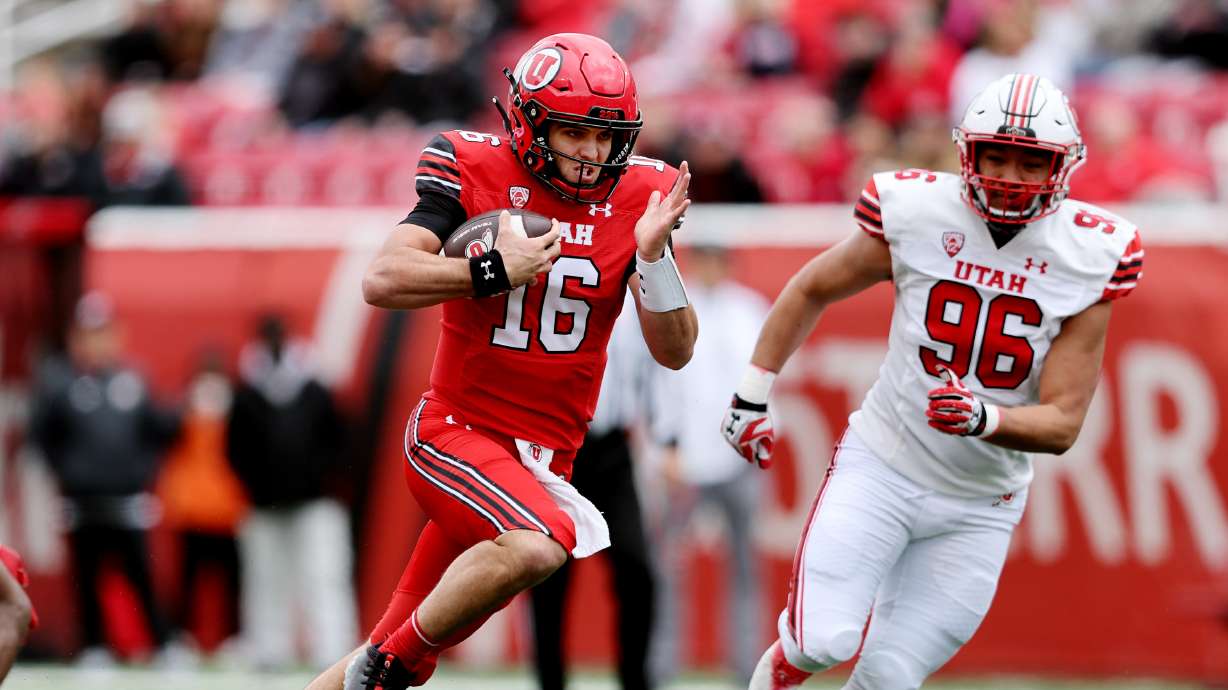 Red quarterback Bryson Barnes, focuses on the end zone as he runs in for a TD as The University of Utah football team plays in the 22 Forever Game at Rice Eccles Stadium in Salt Lake City on Saturday, April 22, 2023. the white team won 38-28 over red.