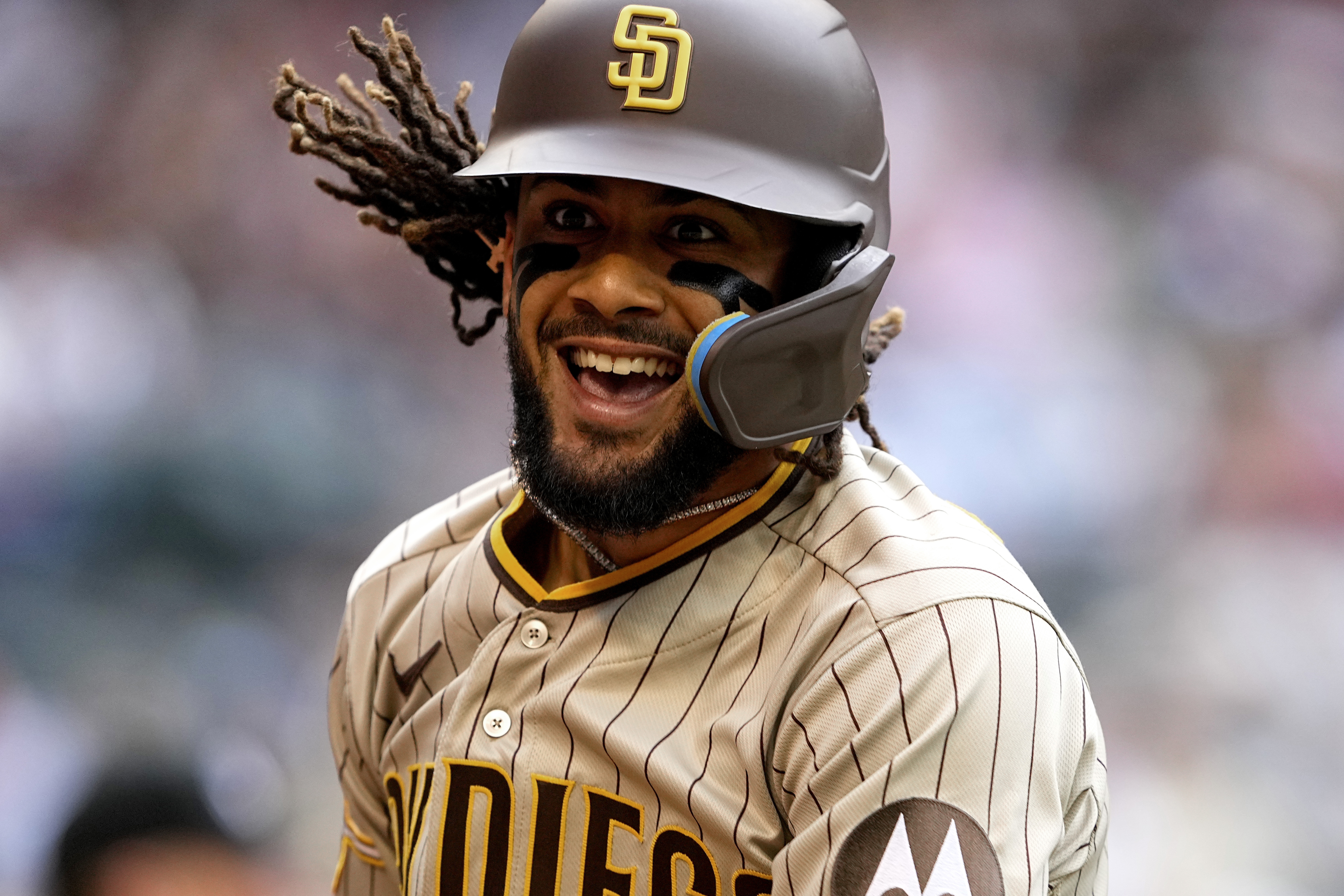 San Diego Padres' Fernando Tatis Jr. celebrates his solo home run against Arizona Diamondbacks during the first inning of a baseball game, Saturday, April 22, 2023, in Phoenix. 