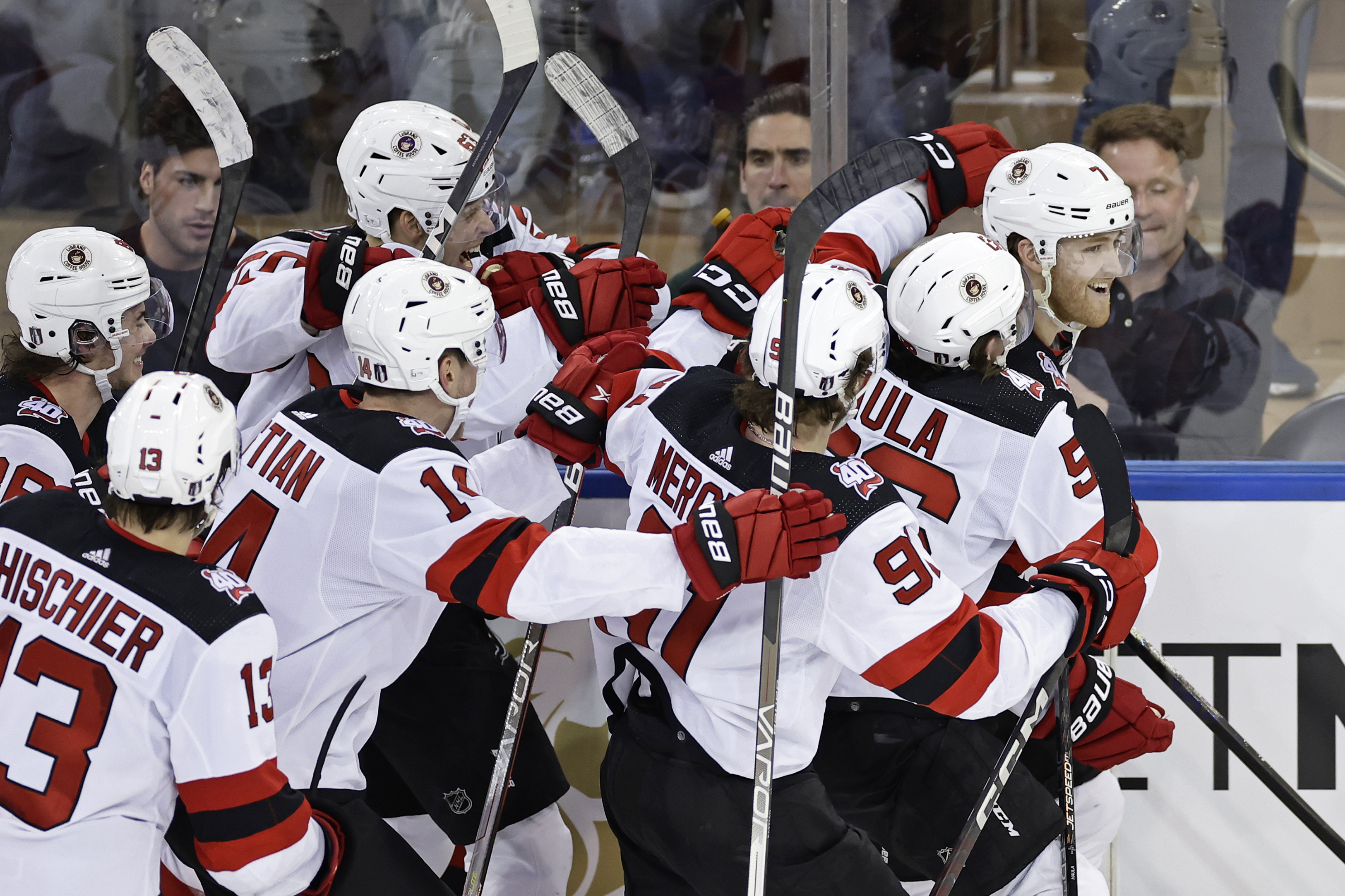 New Jersey Devils defenseman Dougie Hamilton (7) is congratulated by teammates after scoring the game winning goal against the New York Rangers in overtime of Game 3 of the team's NHL hockey Stanley Cup first-round playoff series Saturday, April 22, 2023, in New York. The Devils won 2-1. 