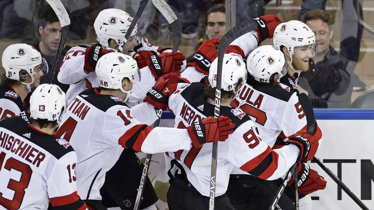New Jersey Devils defenseman Dougie Hamilton (7) is congratulated by teammates after scoring the game winning goal against the New York Rangers in overtime of Game 3 of the team's NHL hockey Stanley Cup first-round playoff series Saturday, April 22, 2023, in New York. The Devils won 2-1.