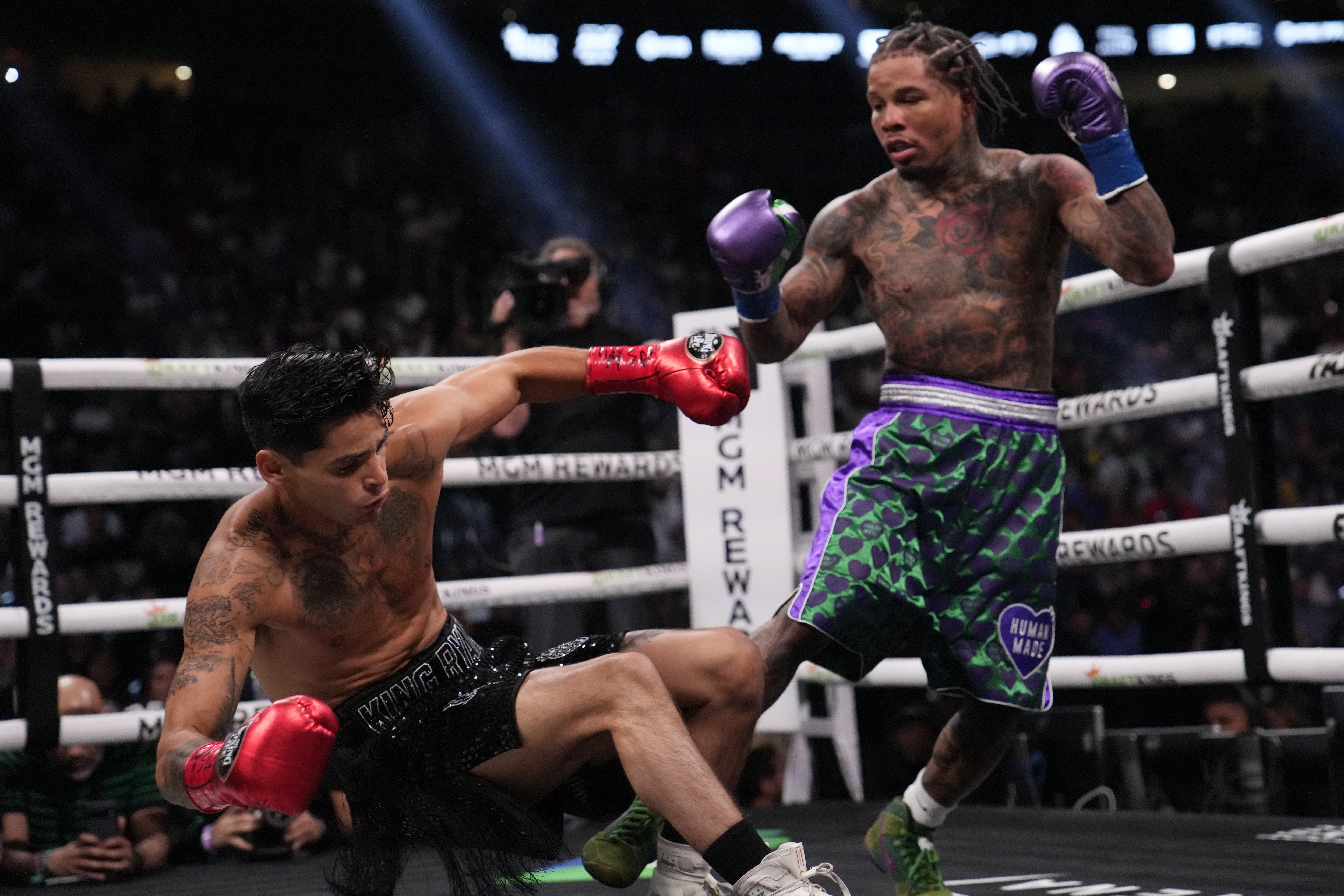 Gervonta Davis knocks down Ryan Garcia in a lightweight boxing bout Saturday, April 22, 2023, in Las Vegas. 
