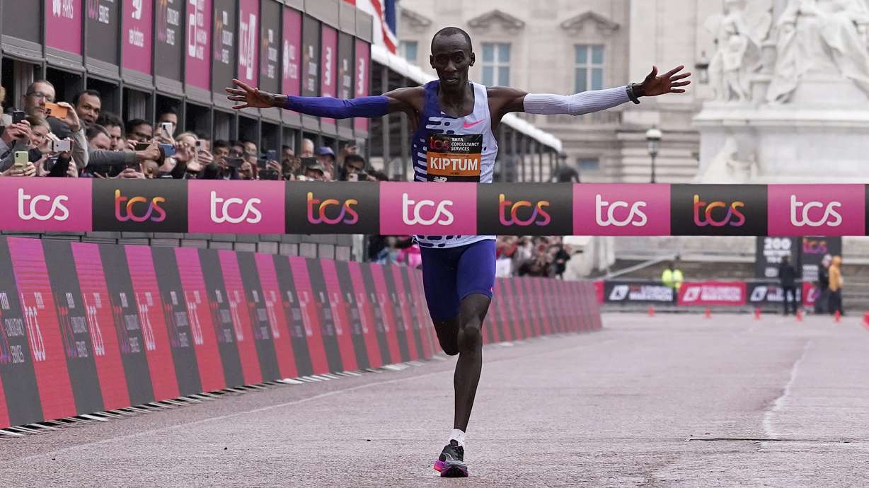Kenya's Kelvin Kiptum crosses the finish line to win the men's race at the London Marathon in London, Sunday, April 23, 2023.