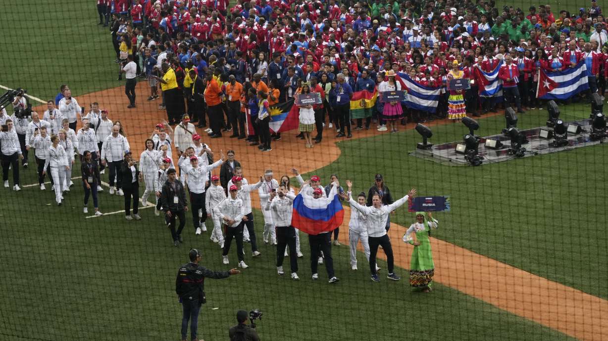 Russian athletes parade in the Alba Games' opening ceremony at the baseball stadium in La Guaira, Venezuela, Friday, April 21, 2023.