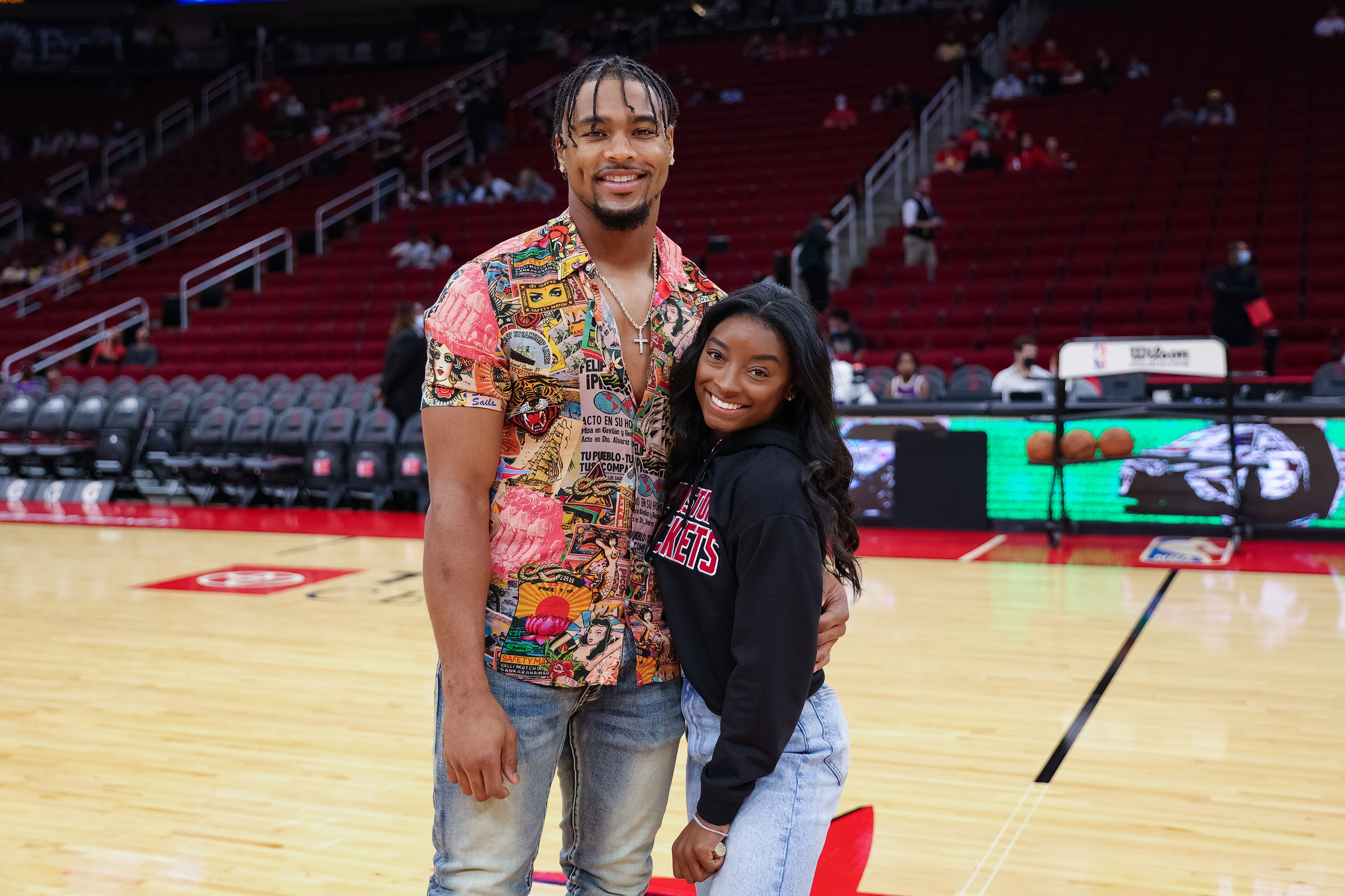 Simone Biles and Jonathan Owens attend a game between the Houston Rockets and the Los Angeles Lakers on Dec. 28, 2021, in Houston, Texas.