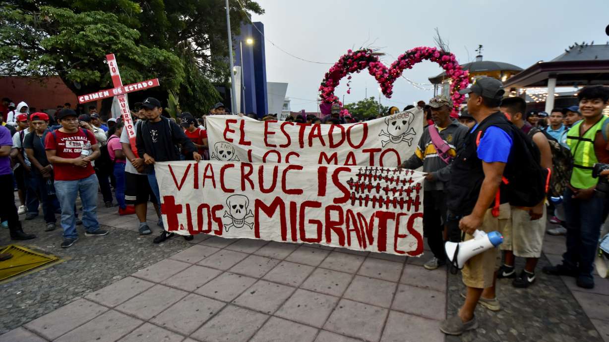Migrants start walking north from Tapachula, Mexico, Sunday. Stuck in southern Mexico, they are angry about 40 people who died in a fire at a detention facility last month.