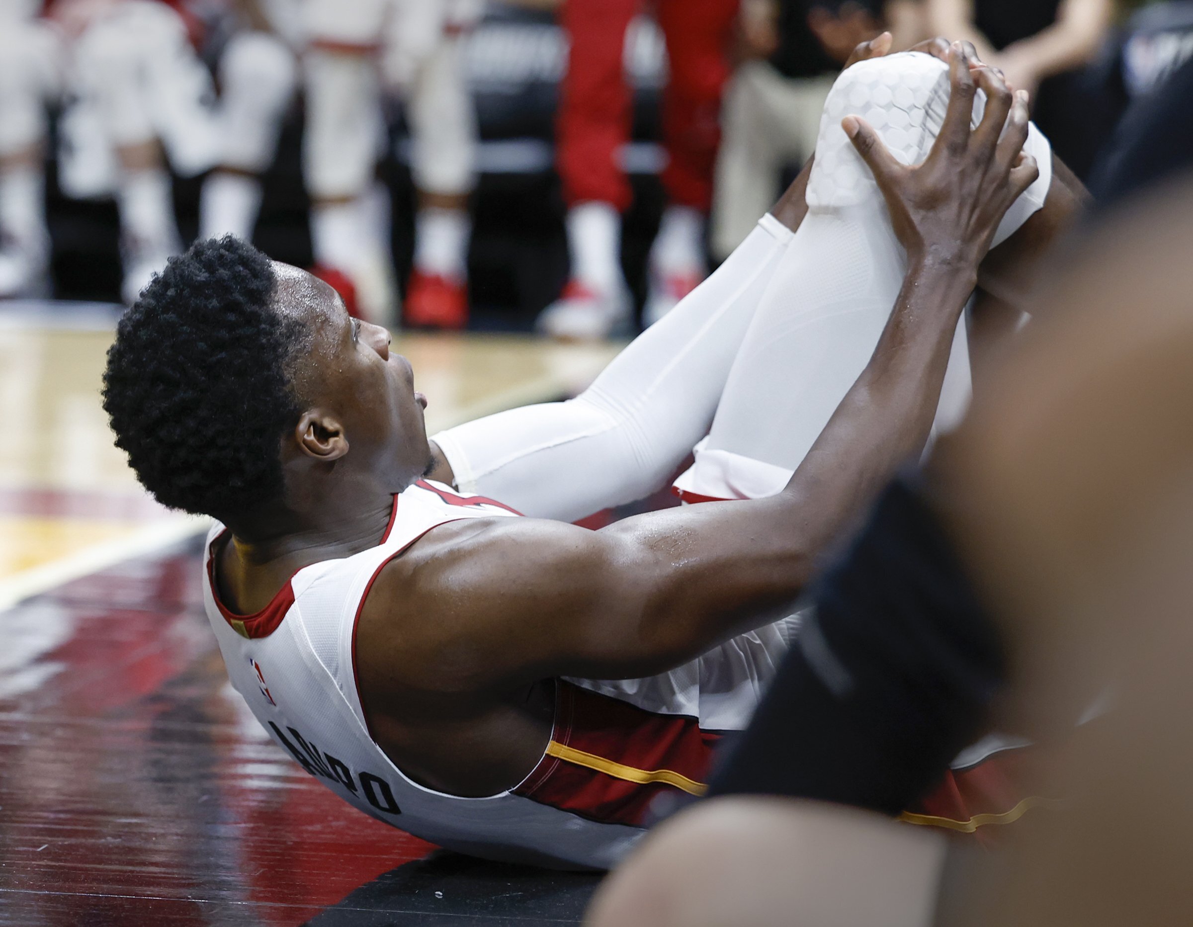 Miami Heat guard Victor Oladipo (4) is injured during the second half of Game 3 in a first-round NBA basketball playoff series against the Milwaukee Bucks, Saturday, April 22, 2023, in Miami. 