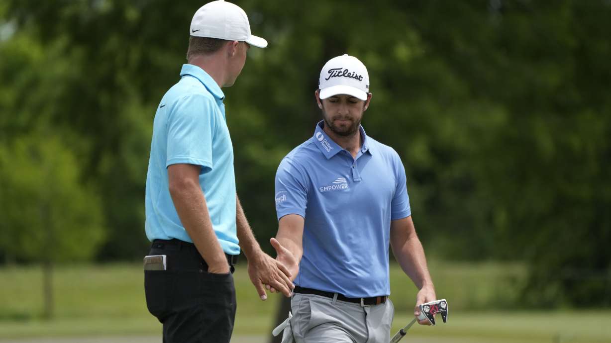 Davis Riley, right, greets his teammate Nick Hardy on the seventh green during the final round of the PGA Zurich Classic golf tournament at TPC Louisiana in Avondale, La., Sunday, April 23, 2023.