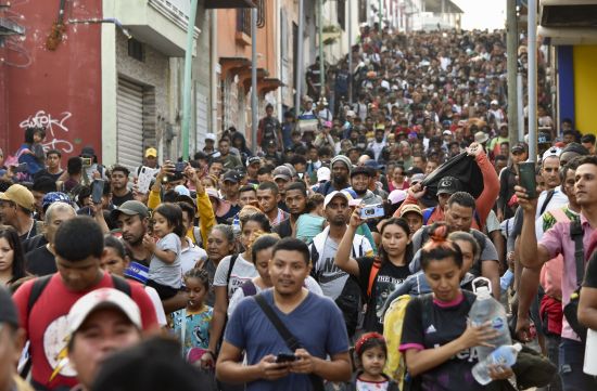 Migrants start walking north on their way to Mexico City from Tapachula, Chiapas state, Mexico, Sunday.