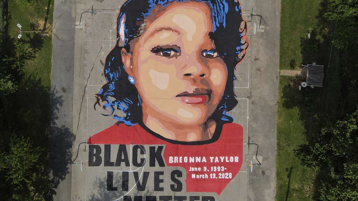 A ground mural depicting a portrait of Breonna Taylor is seen at Chambers Park in Annapolis, Md., July 6, 2020. The former Louisville Metro police officer who fatally shot Breonna Taylor has a new job in law enforcement.