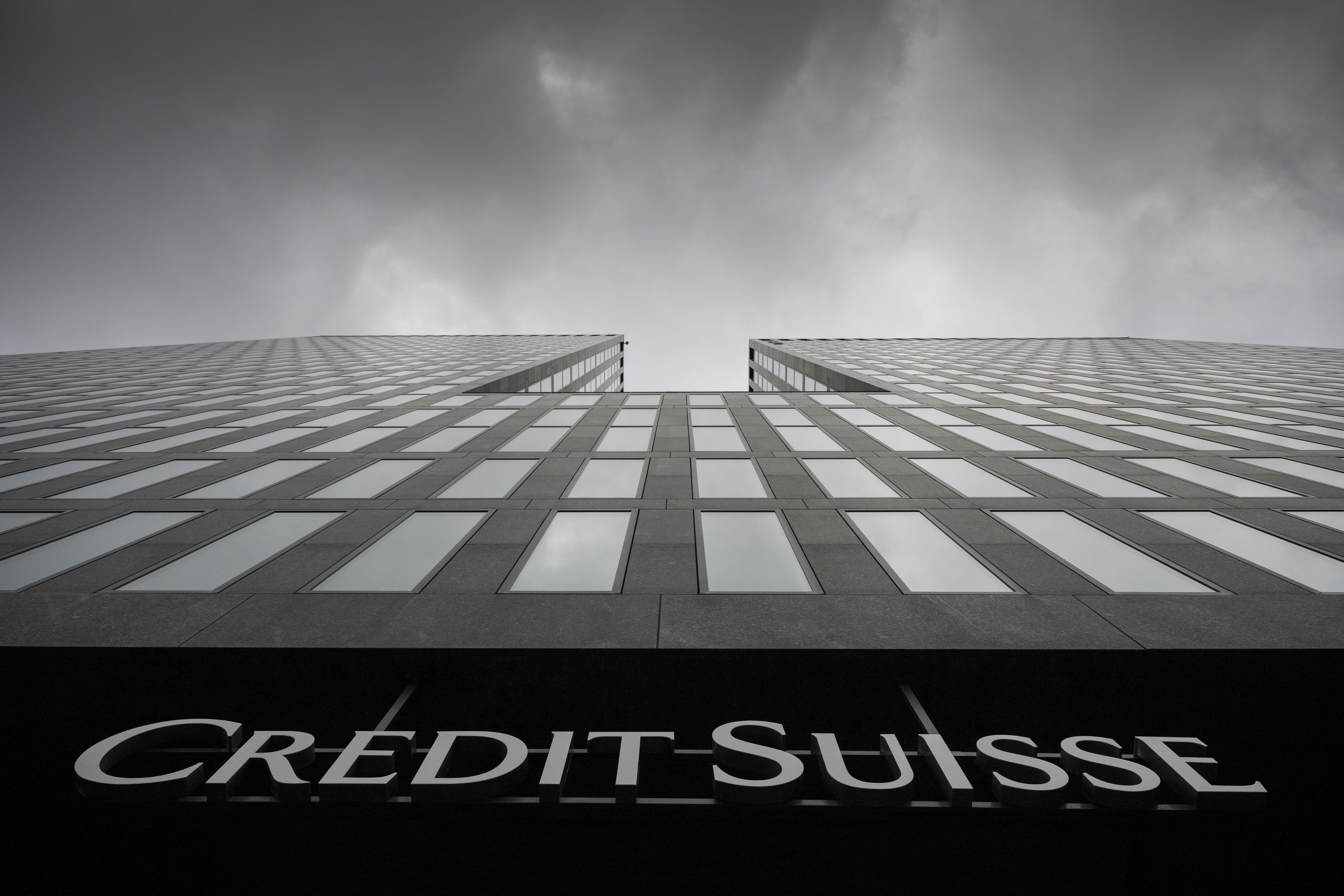 Grey clouds cover the sky over a building of the Credit Suisse bank in Zurich, Switzerland, on Feb. 21, 2022. In a report released last month, a team of researchers from Quebec and France say bacteria with antibiotic-resistant genes can spread through the clouds.