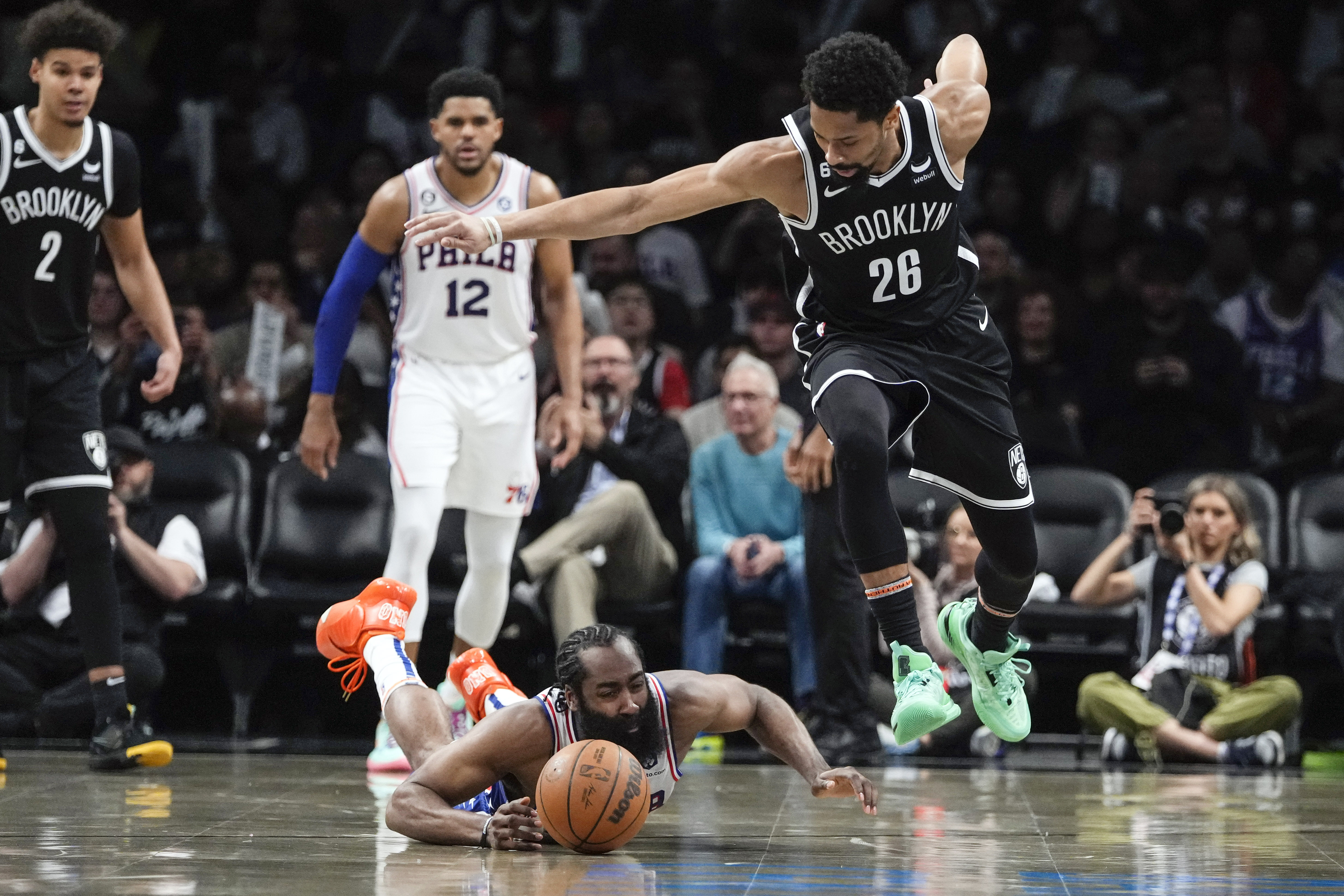 Philadelphia 76ers' James Harden, left, fights for control of the ball with Brooklyn Nets' Spencer Dinwiddie (26) during the second half of Game 4 in an NBA basketball first-round playoff series Saturday, April 22, 2023, in New York. 